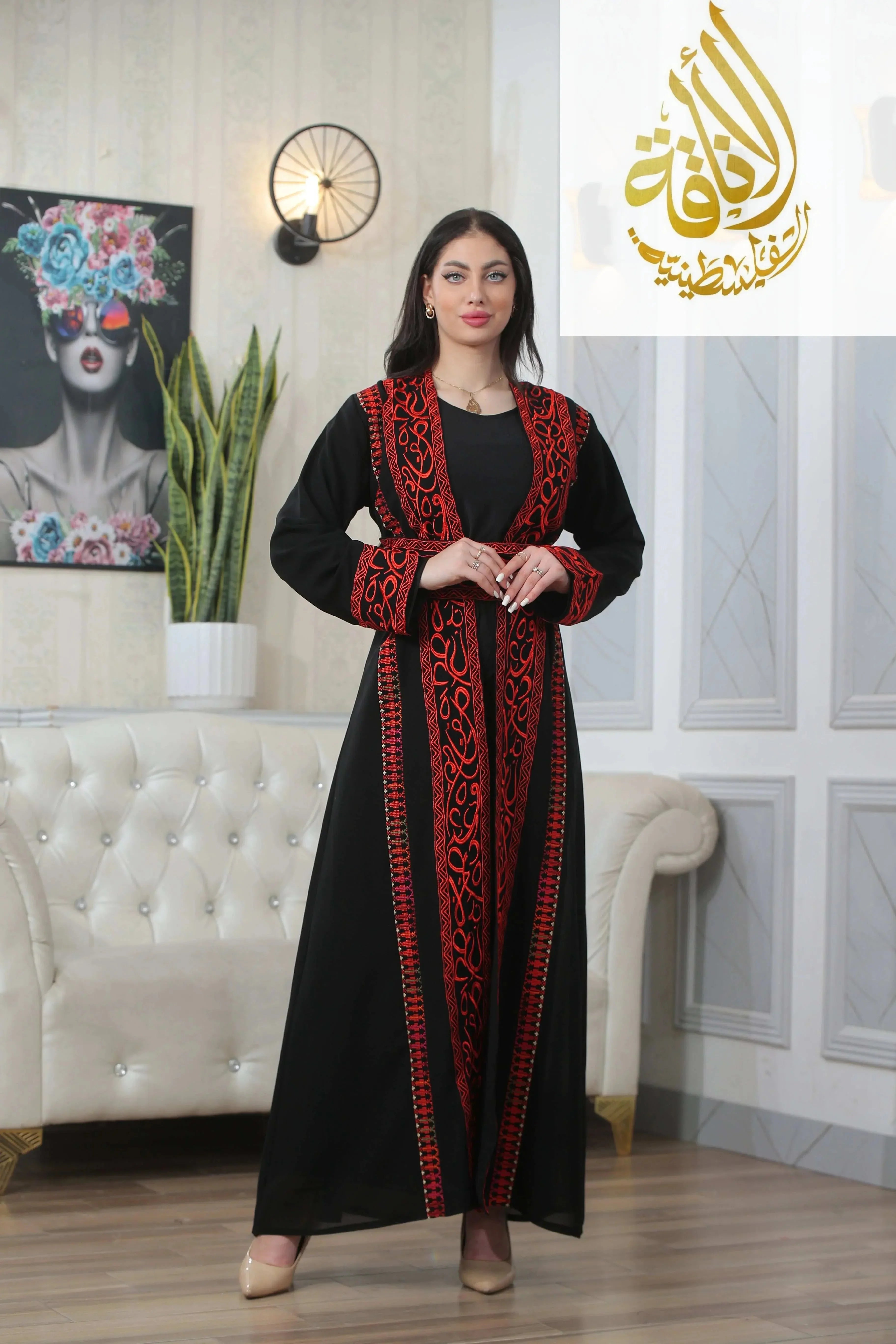 Elegant black thoub by Palestinian Elegance featuring Basma Arabic letters with heritage embroidery Bisht in red thread