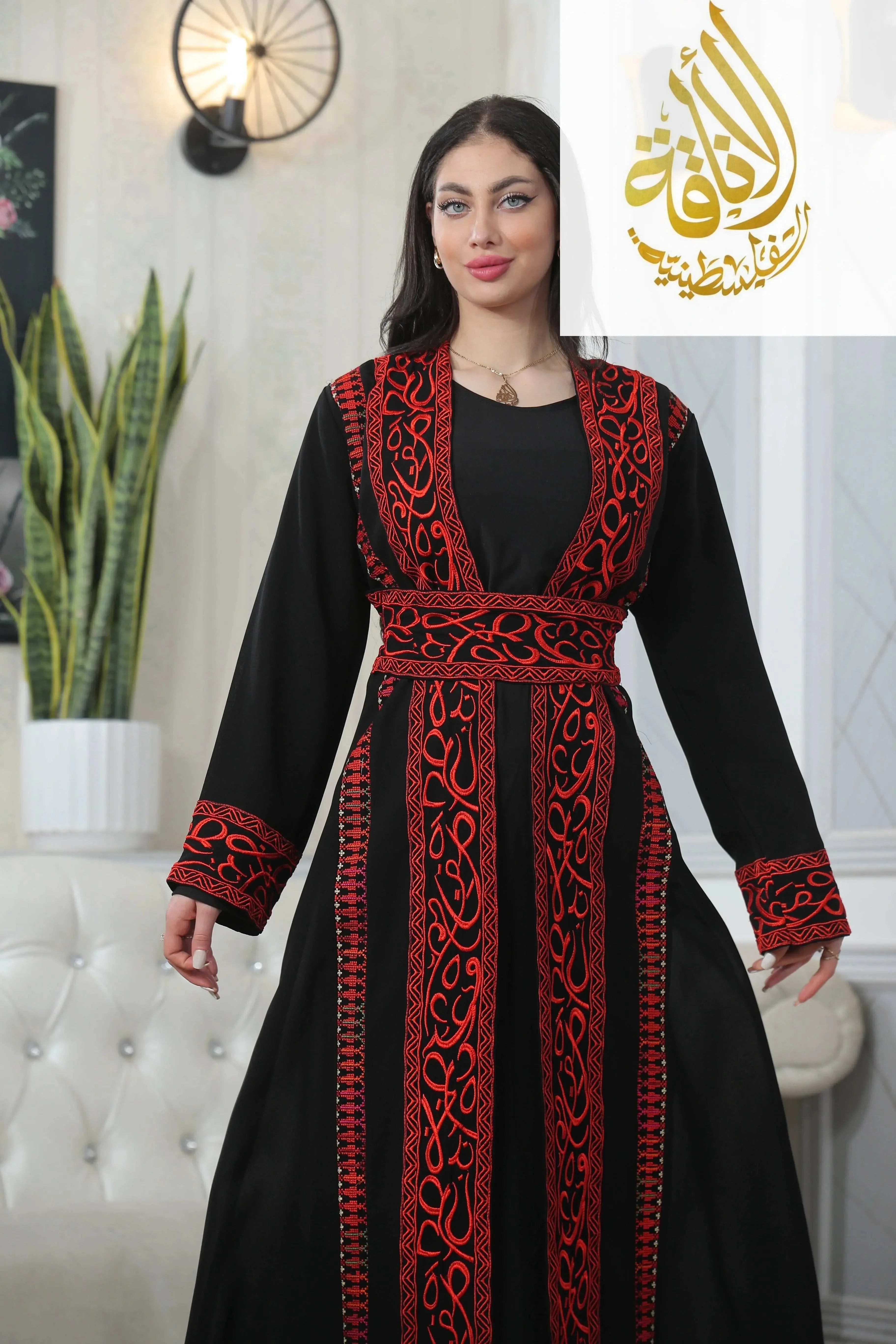 Basma Arabic letters with heritage embroidery Bisht thoub by Palestinian Elegance in black with red detailed embroidery