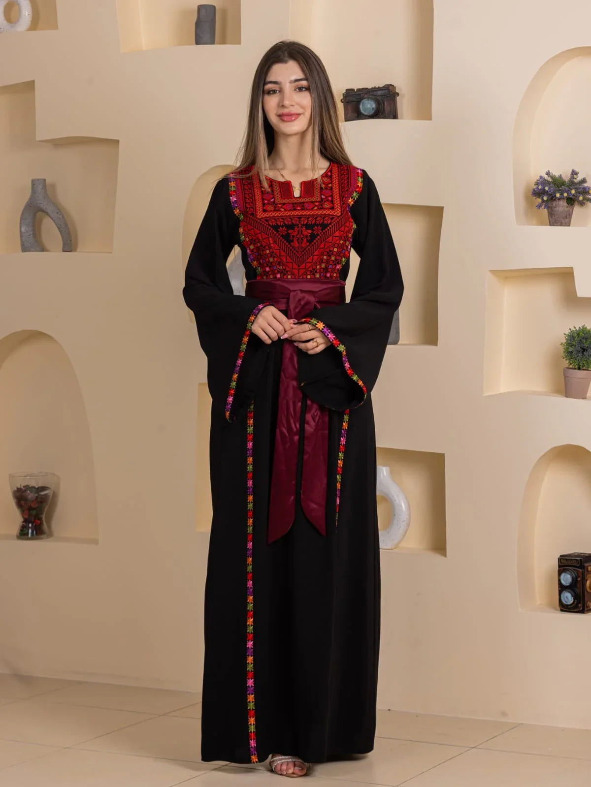 Palestinian Elegance Blossom Embroidered Thobe black with red chest embroidery and burgundy sash belt