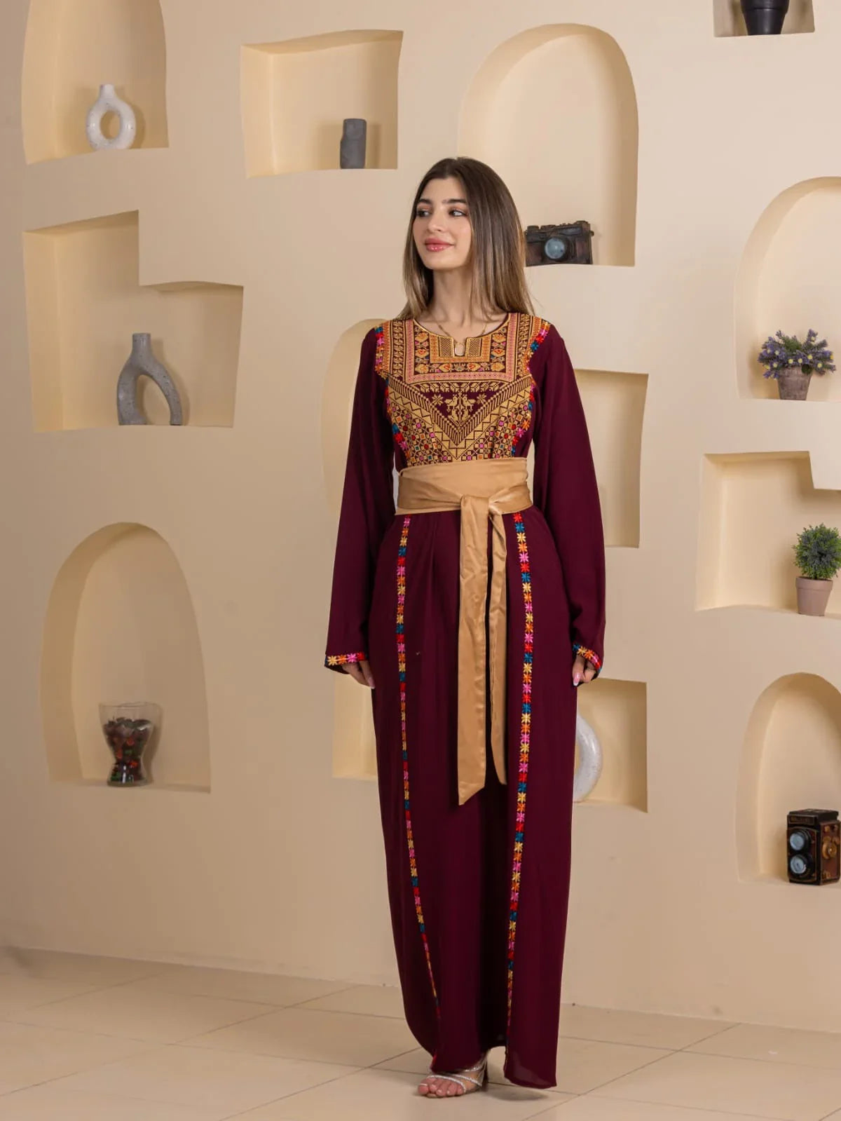 Blossom Embroidered Thobe by Palestinian Elegance maroon traditional dress with gold sash and multicolor embroidery