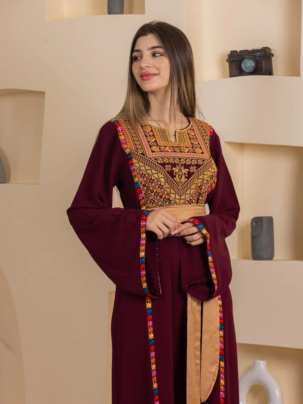 Blossom Embroidered Thobe by Palestinian Elegance burgundy thobe with intricate multicolor chest embroidery and gold sash