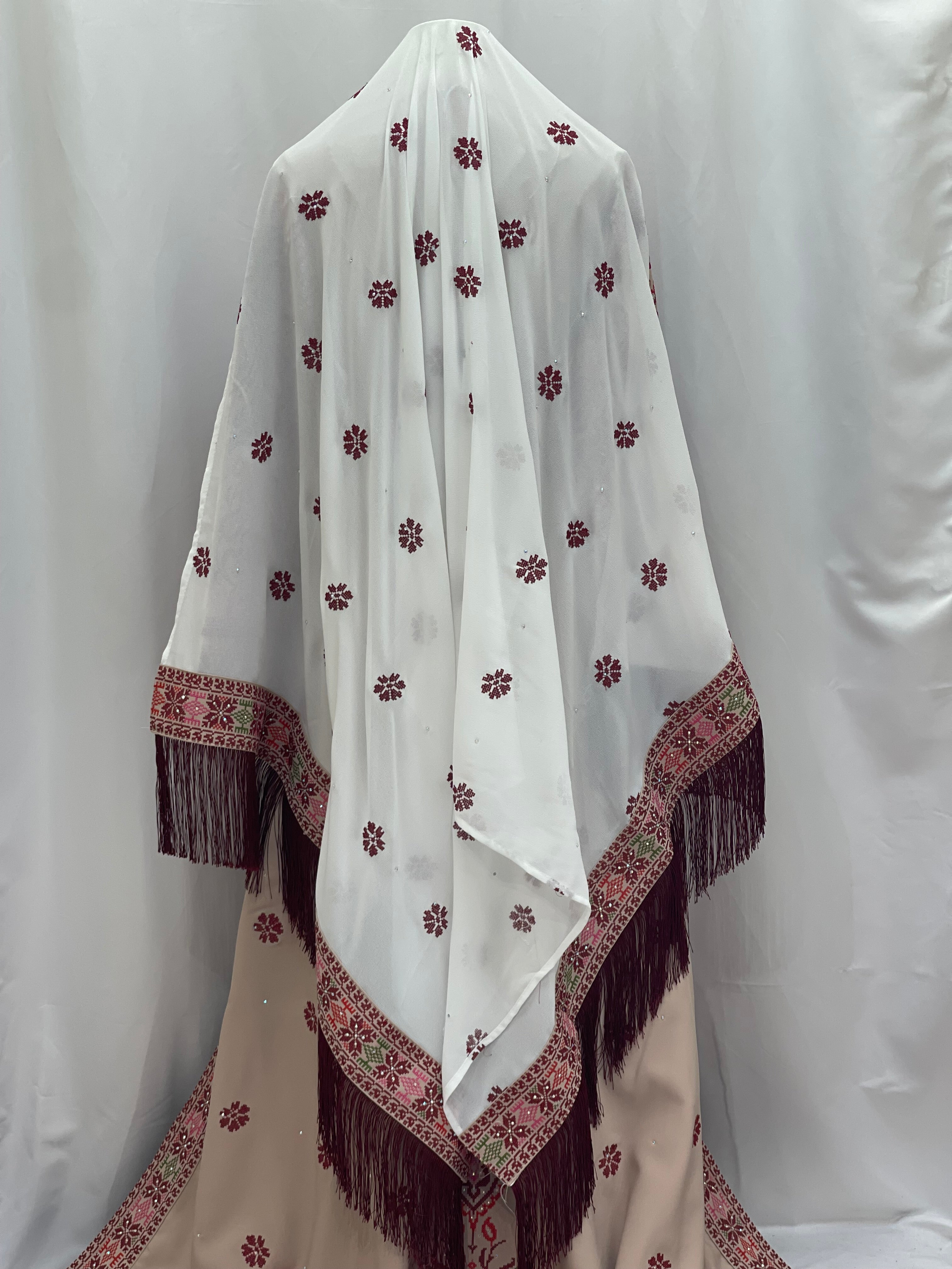 Bride of Roses Thobe featuring intricate floral embroidery and elegant fringed design