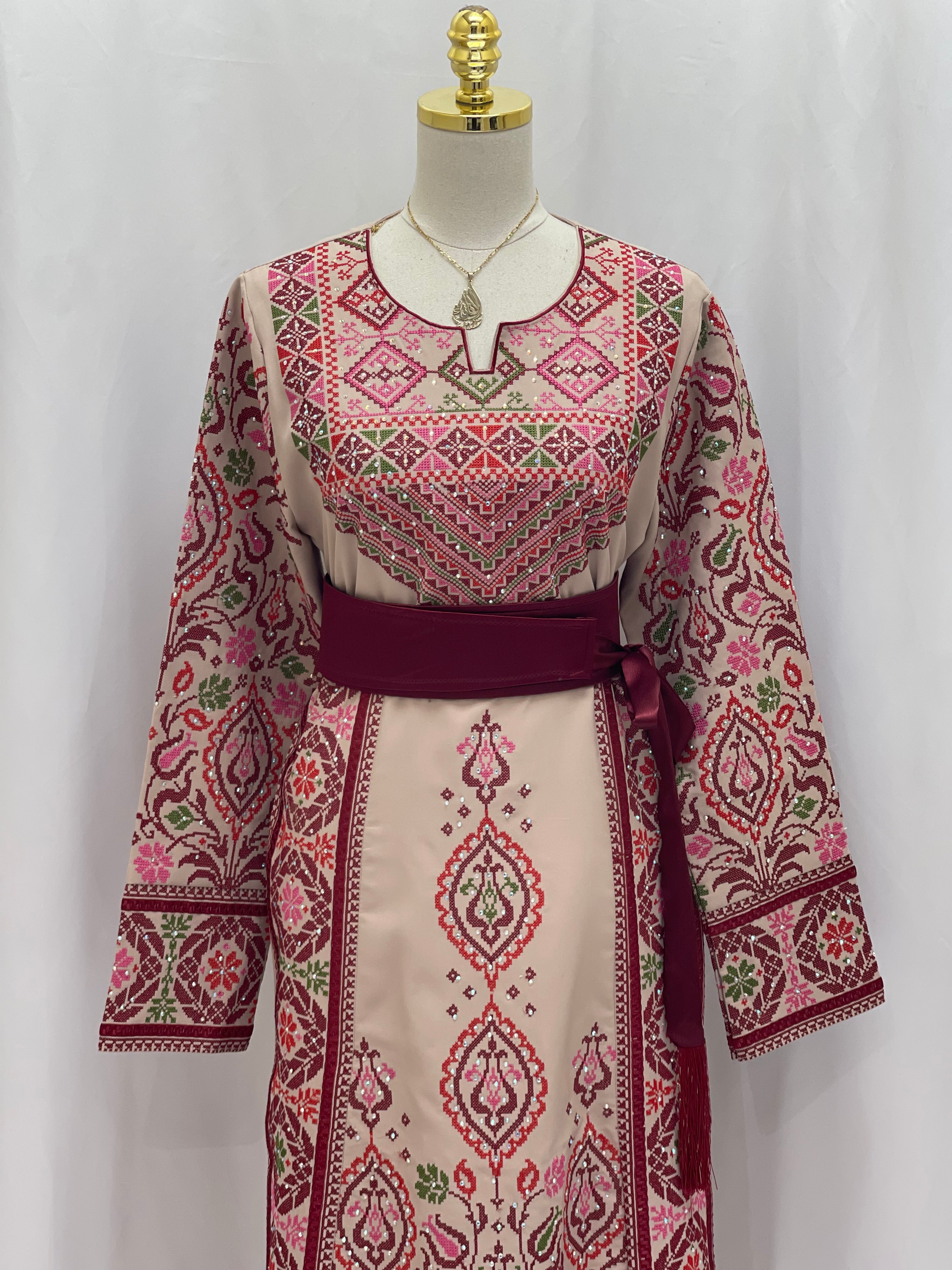 Bride of Roses Thobe with intricate floral embroidery and a stylish belt for elegant attire