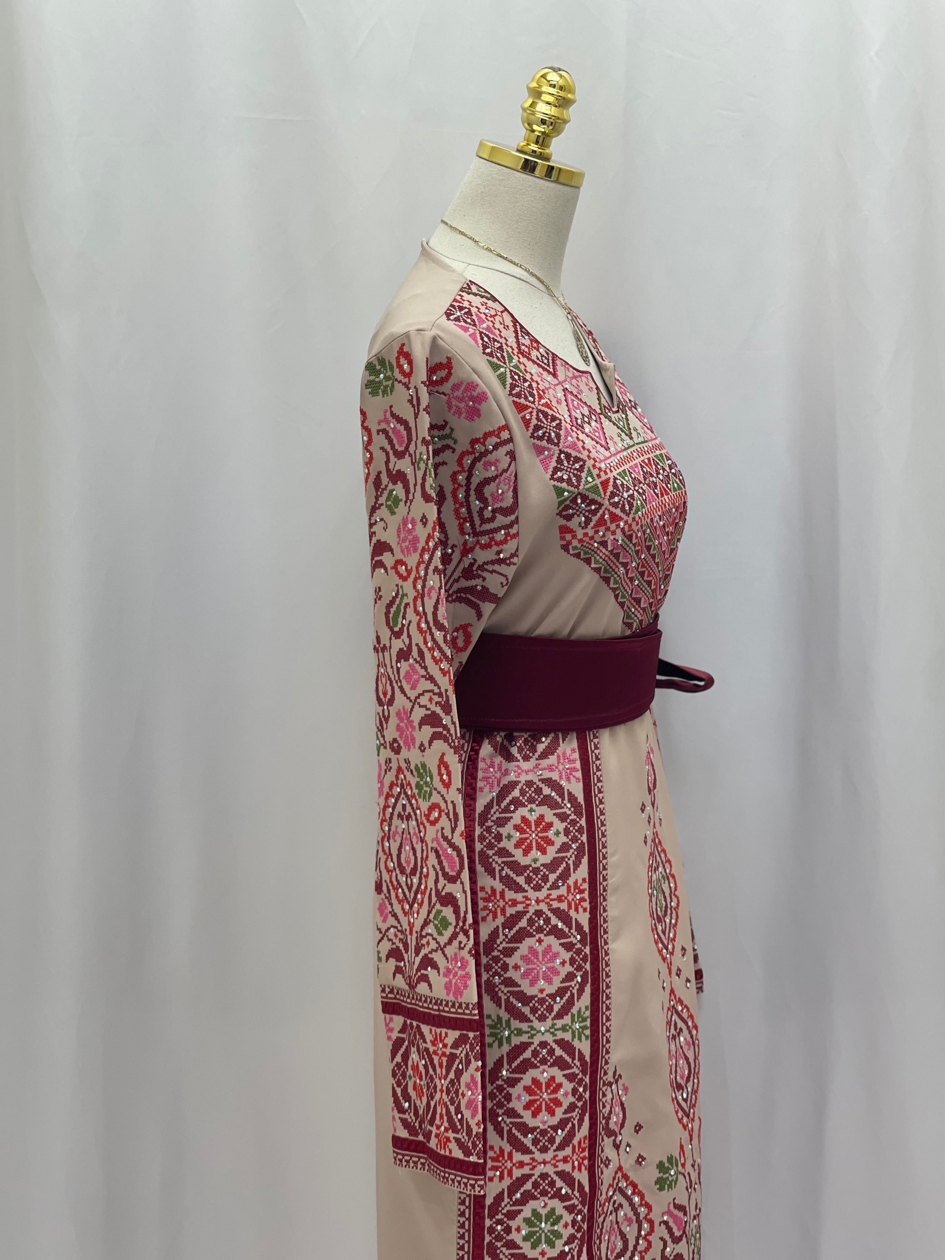 Elegant Bride of Roses Thobe featuring intricate embroidery and a stylish belt, perfect for special occasions.