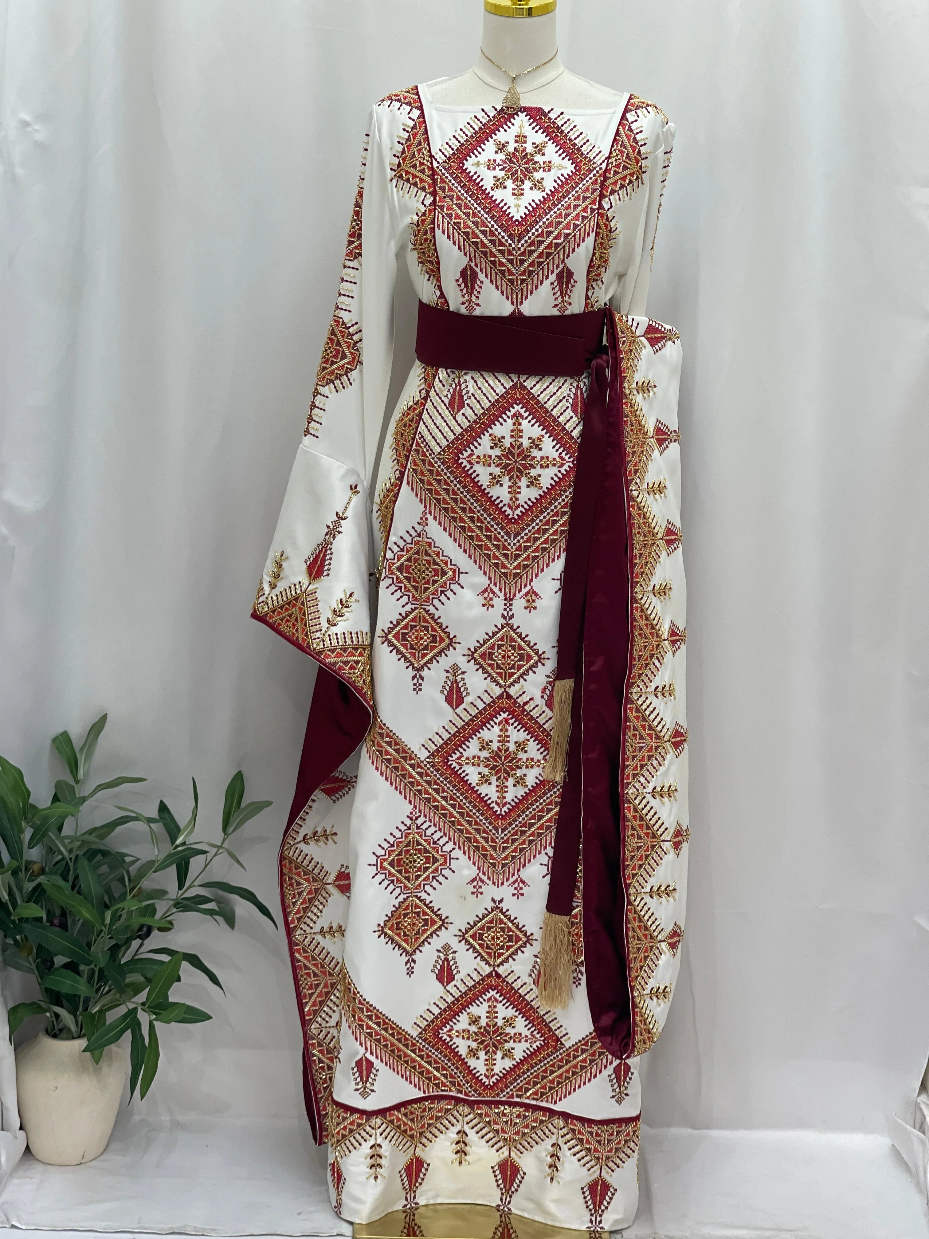 Palestinian Elegance Orient Modren Embroidered Dress white embroidered thobe with red geometric motifs and burgundy waist sash