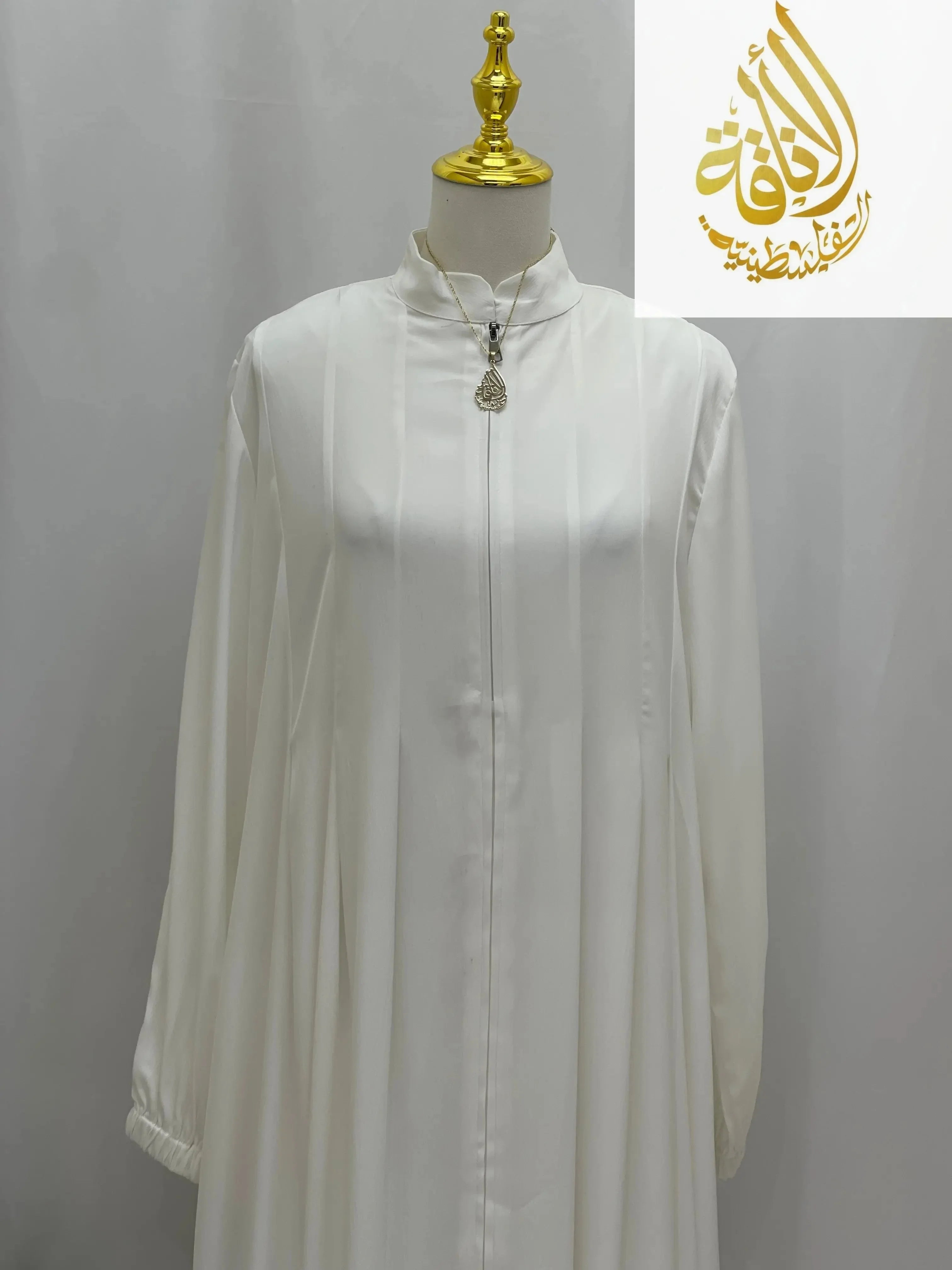 Palestinian Elegance classic white abaya with long sleeves and modest high neckline on mannequin