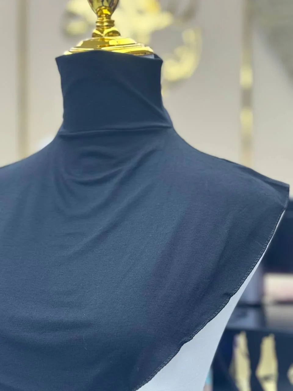 Palestinian Elegance navy blue Cotton Lightweight Turtle Neck on mannequin showing smooth drape and high collar