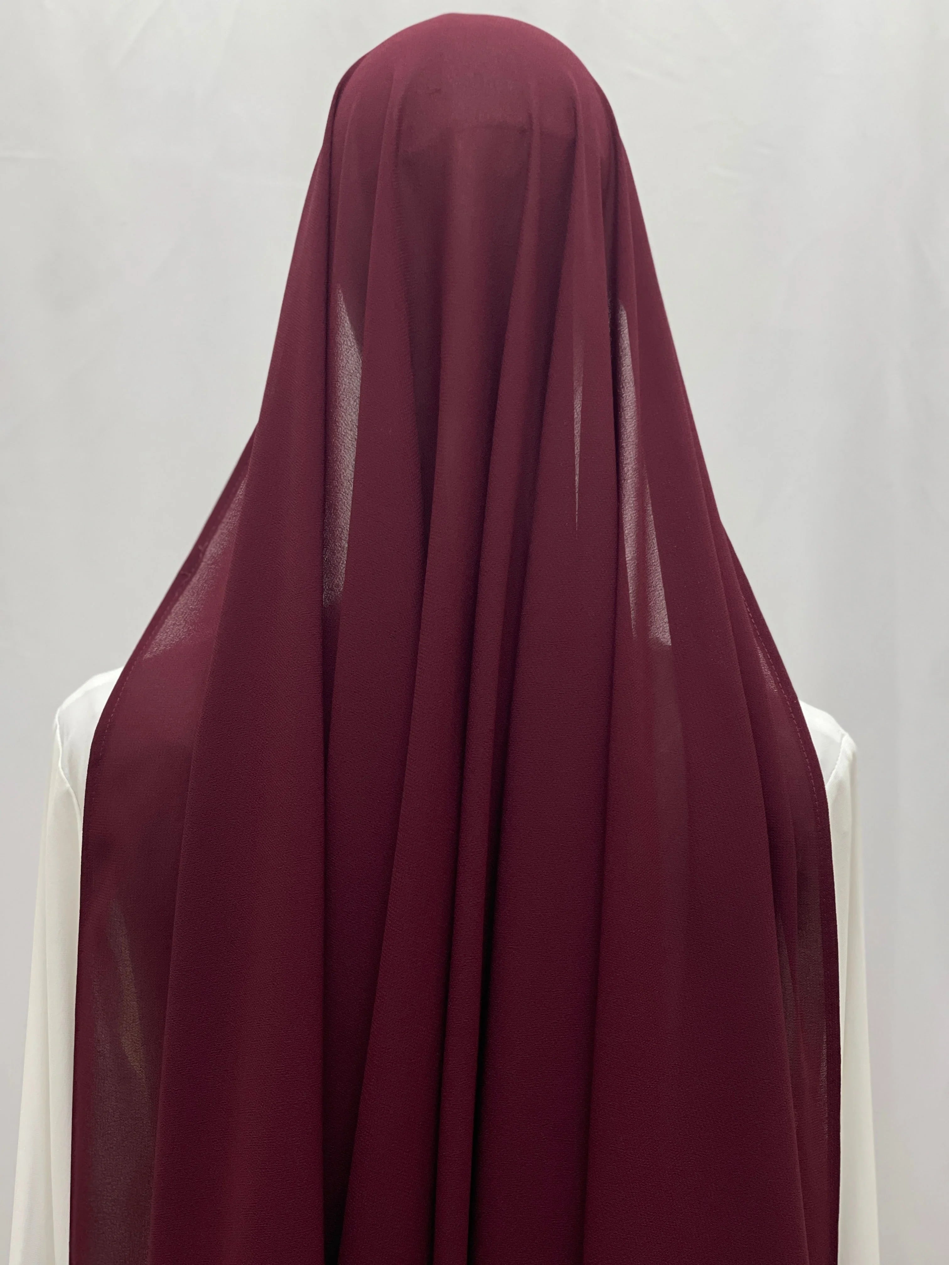 Palestinian Elegance Dark Maroon Khirka With Tassel draped over mannequin back view lightweight chiffon