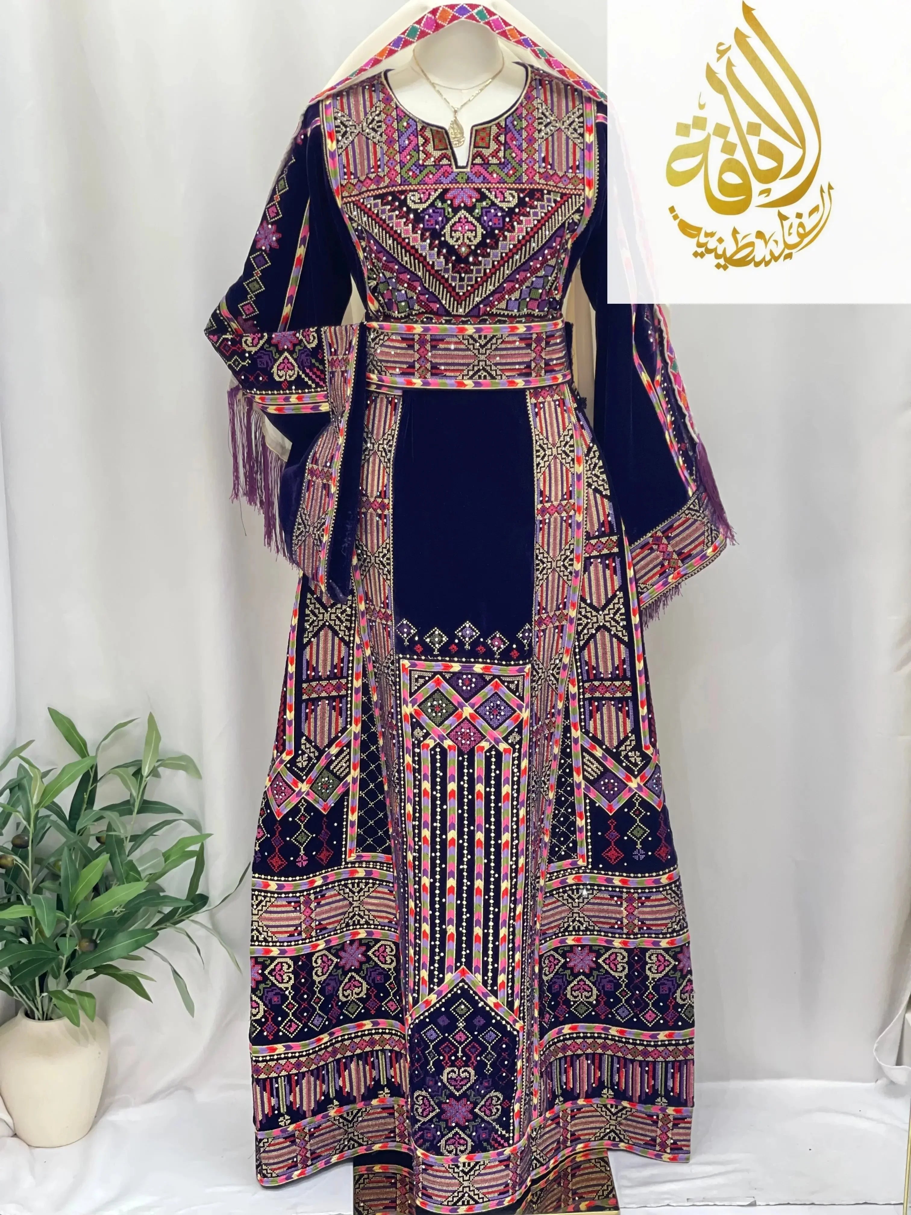 Palestinian Elegance embroidered velvet thoub with intricate colorful embroidery on navy velvet fabric
