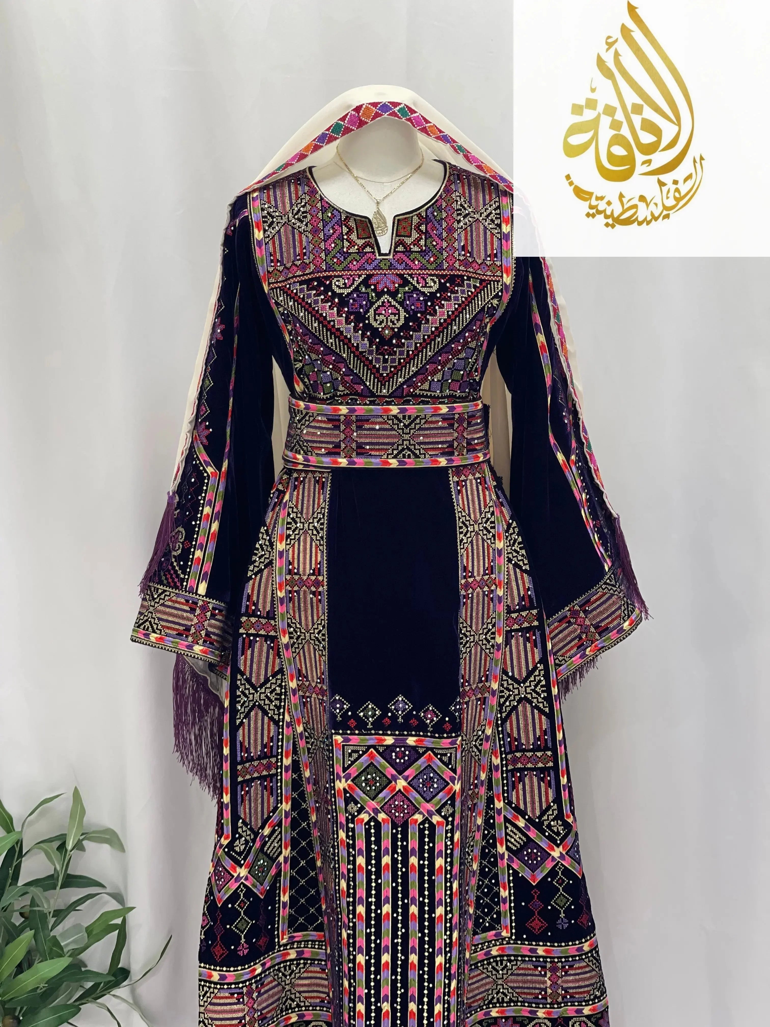 Palestinian Elegance embroidered velvet thoub with intricate multicolor embroidery on deep navy velvet fabric