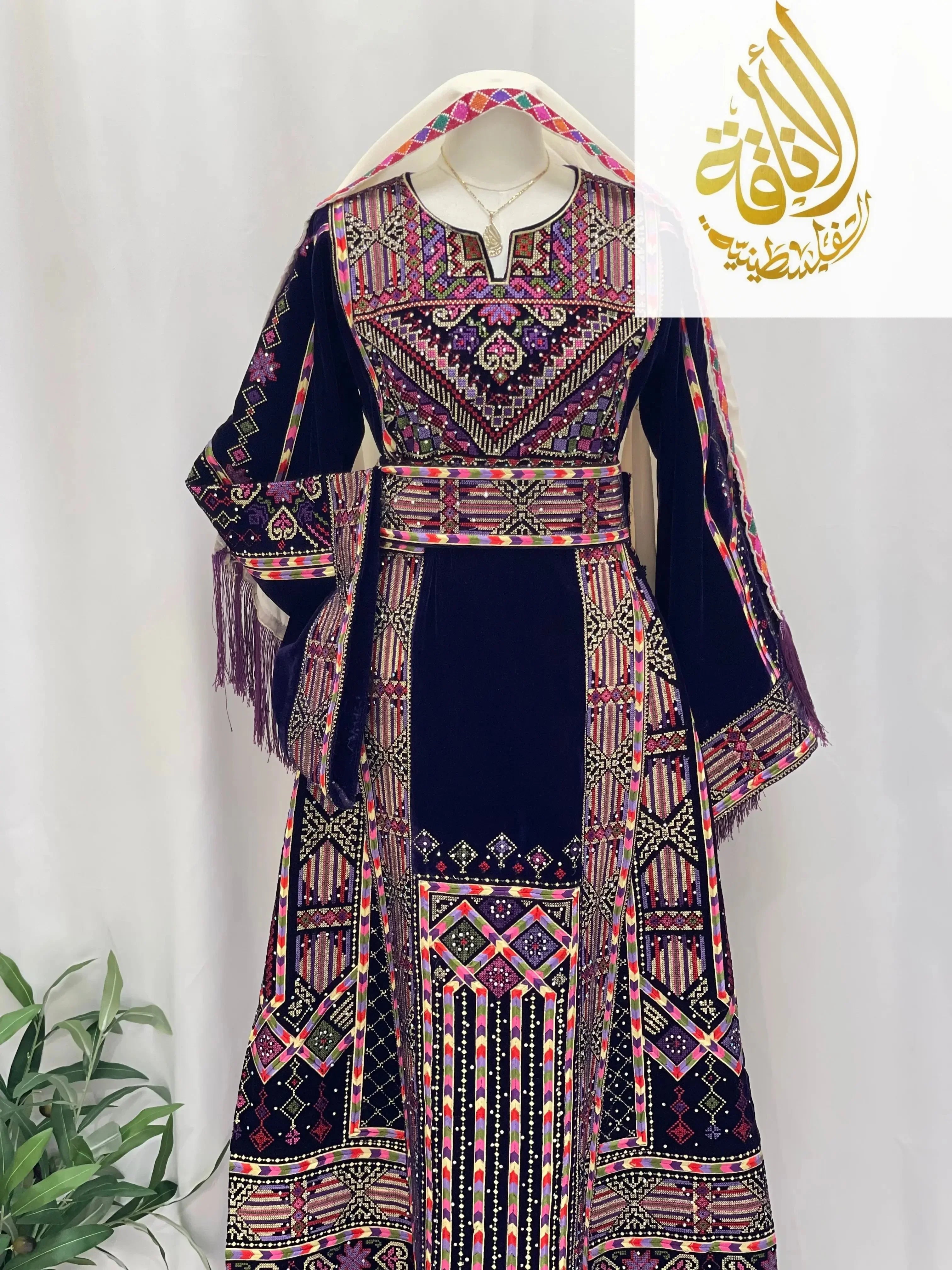 Palestinian Elegance embroidered velvet thoub with intricate multicolor embroidery on deep navy fabric