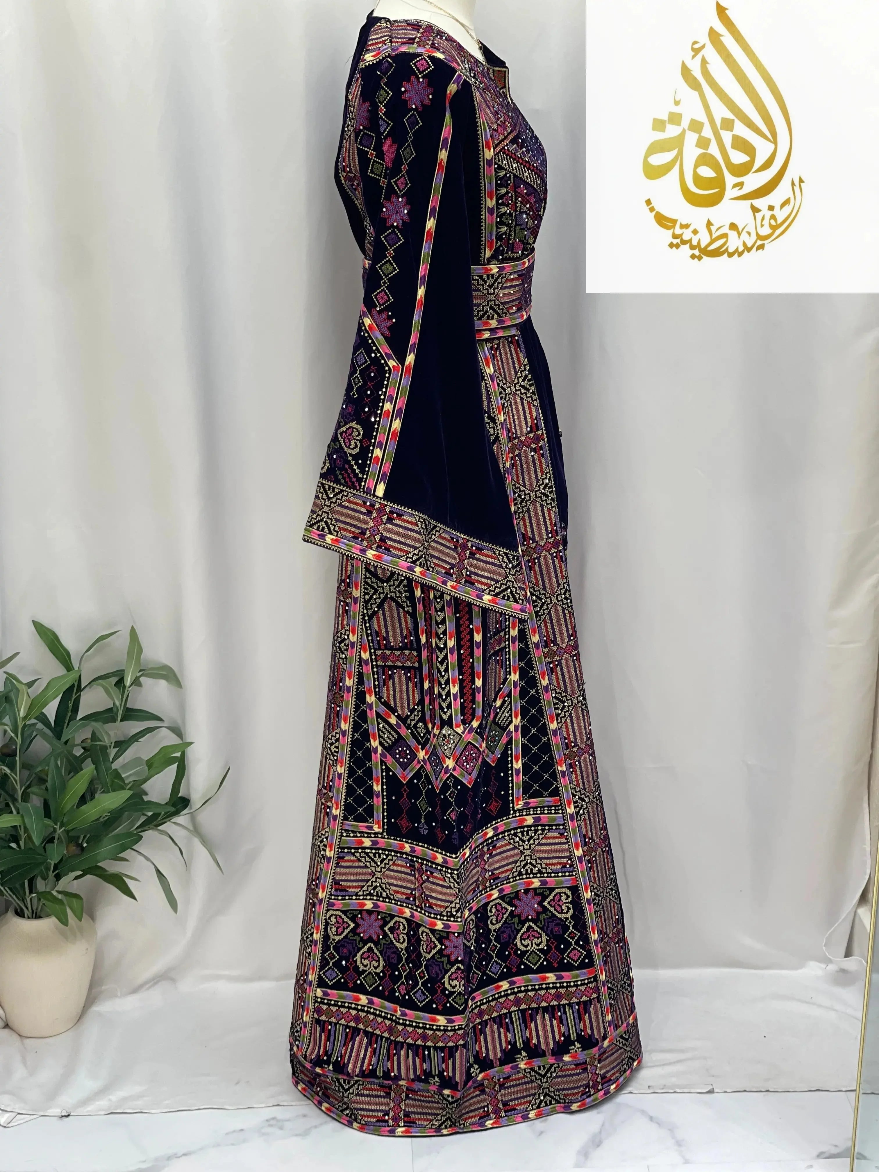 Palestinian Elegance embroidered velvet thoub in dark blue with intricate colorful embroidery details