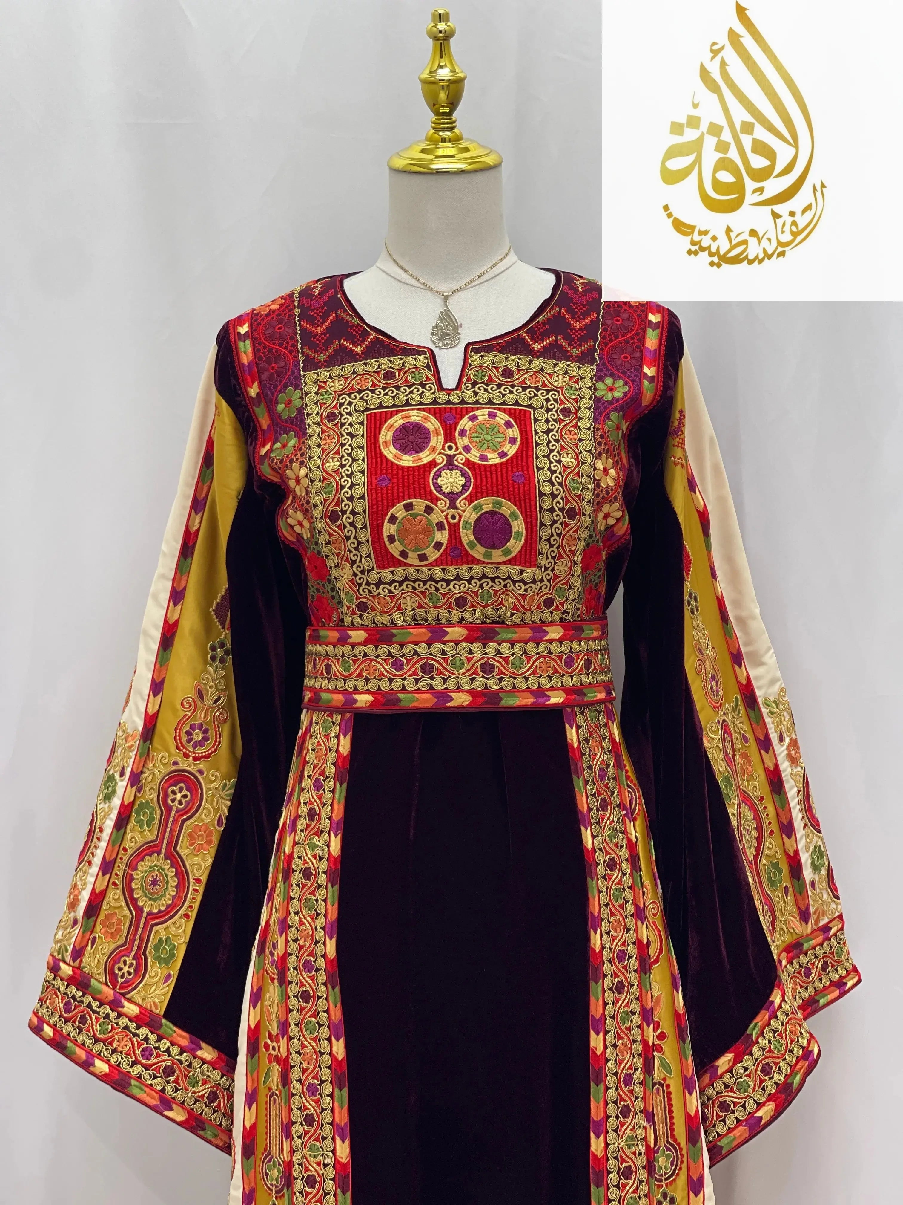 Deep Burgundy Palestinian Embroidered thobe by Palestinian Elegance with intricate gold and red traditional embroidery