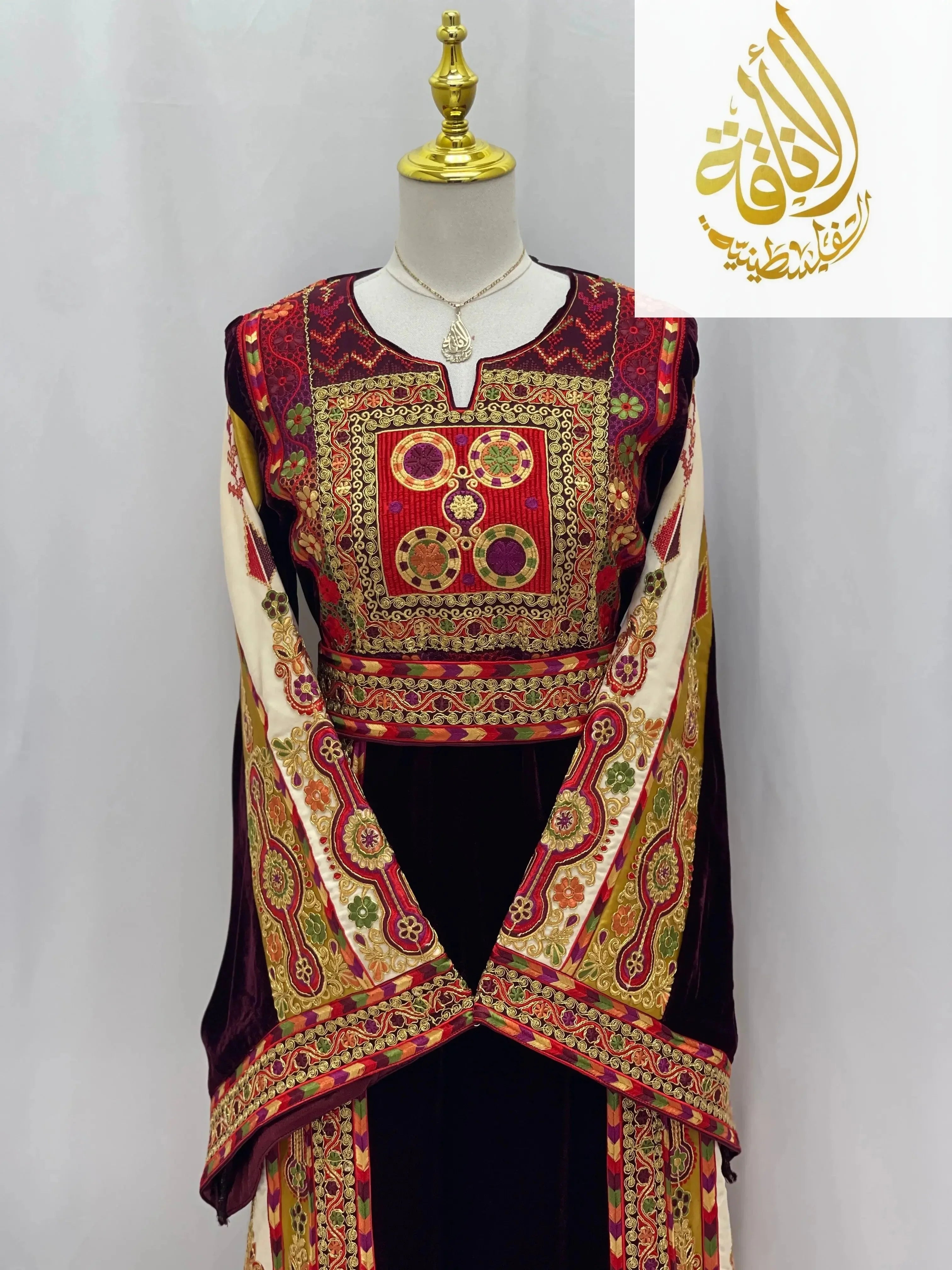 Deep Burgundy Palestinian Embroidered thobe with intricate gold and red traditional designs by Palestinian Elegance