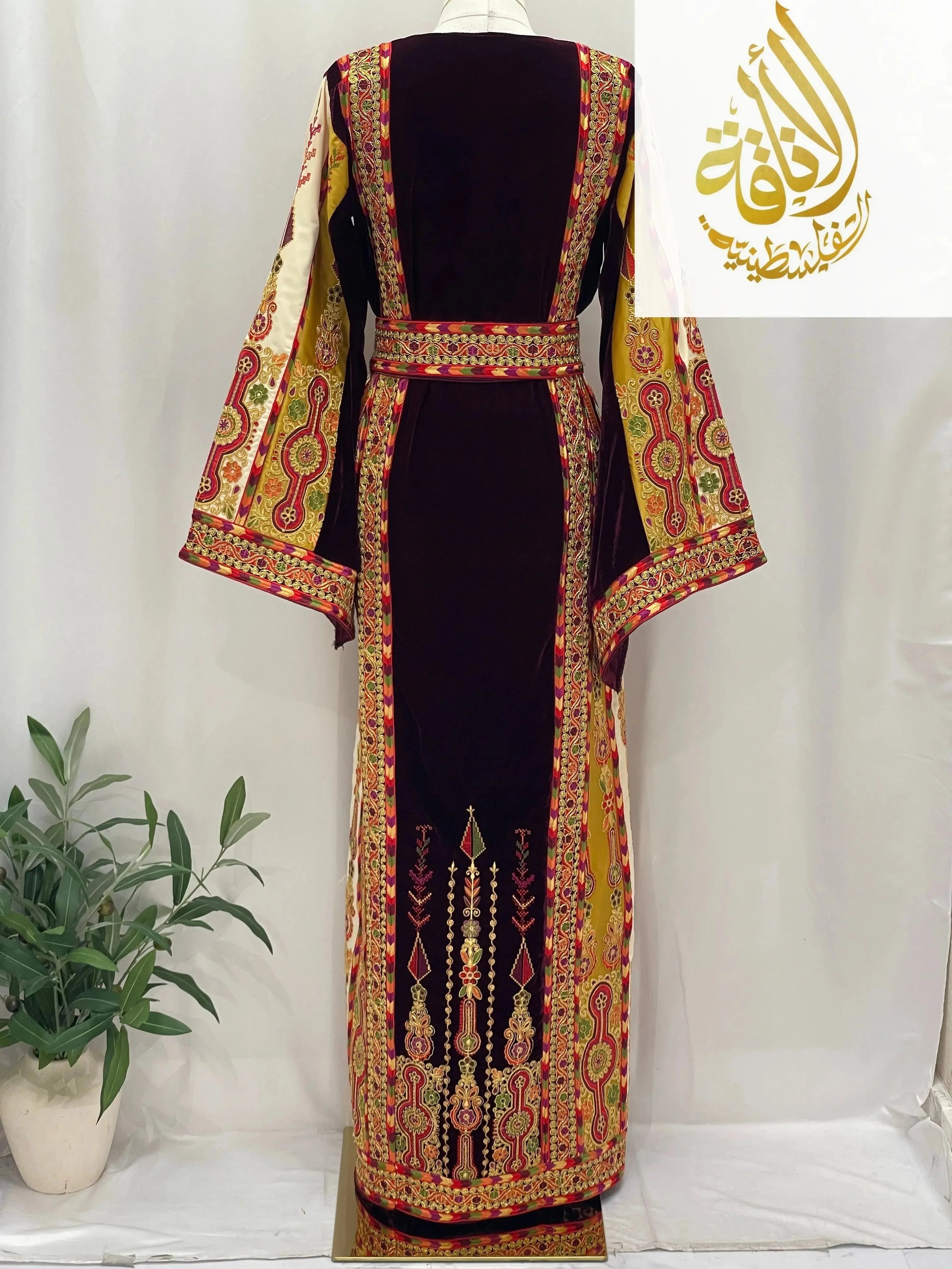 Deep Burgundy Palestinian Embroidered thobe with intricate traditional patterns and wide sleeves by Palestinian Elegance