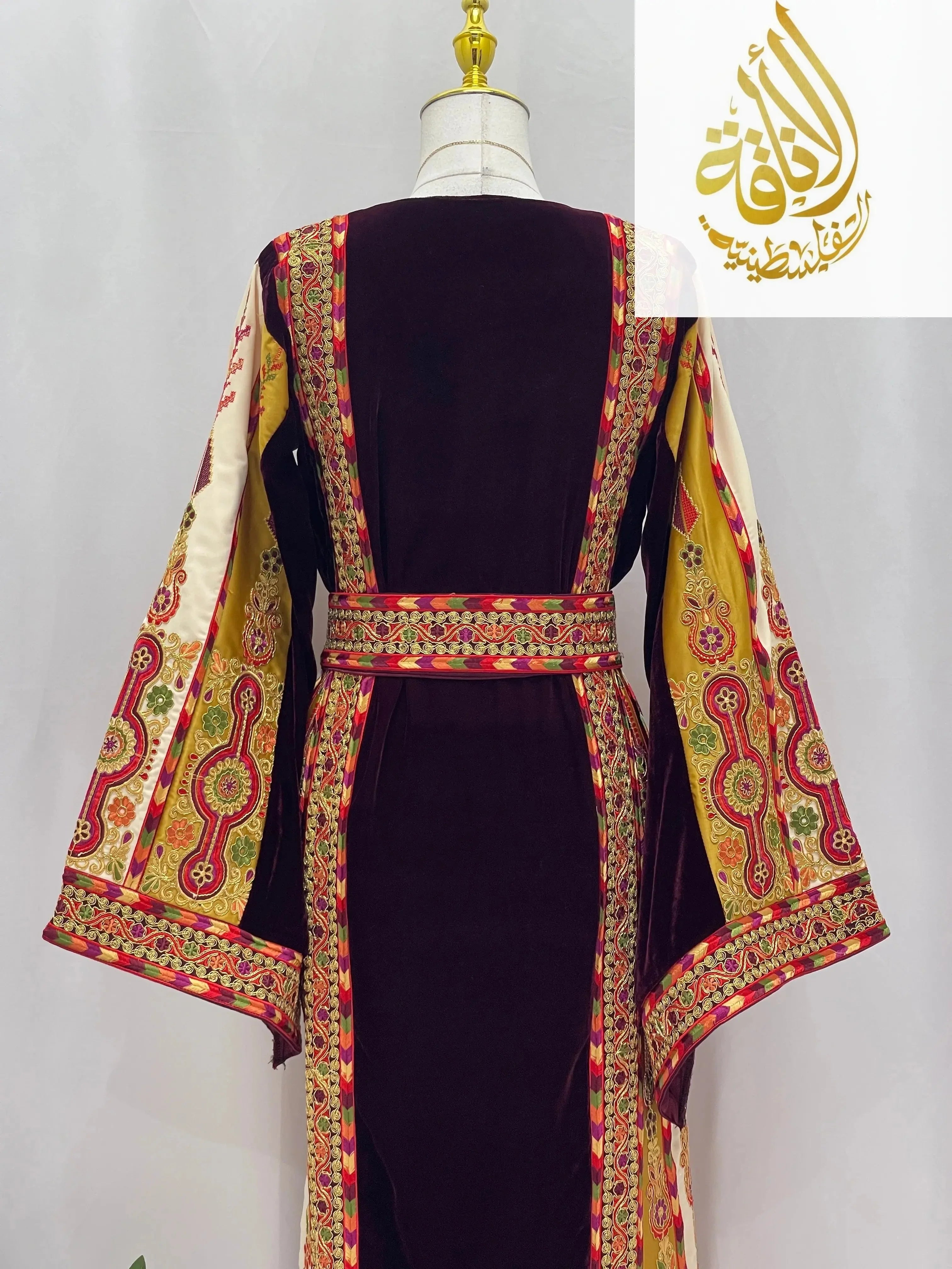 Deep Burgundy Palestinian Embroidered thobe with intricate colorful sleeve and belt embroidery by Palestinian Elegance
