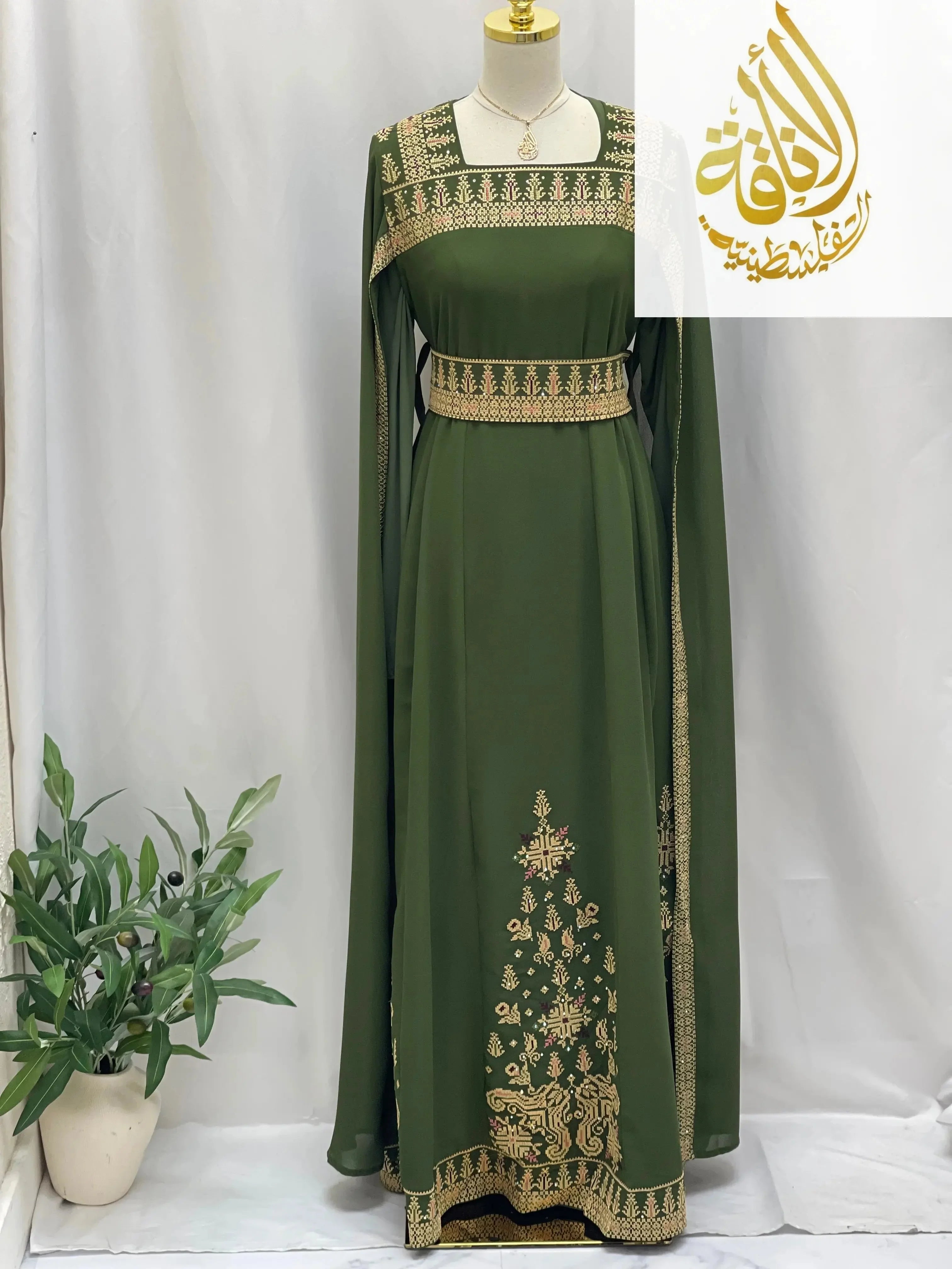 Embroidered Palestinian dress in olive green with intricate golden embroidery by Palestinian Elegance