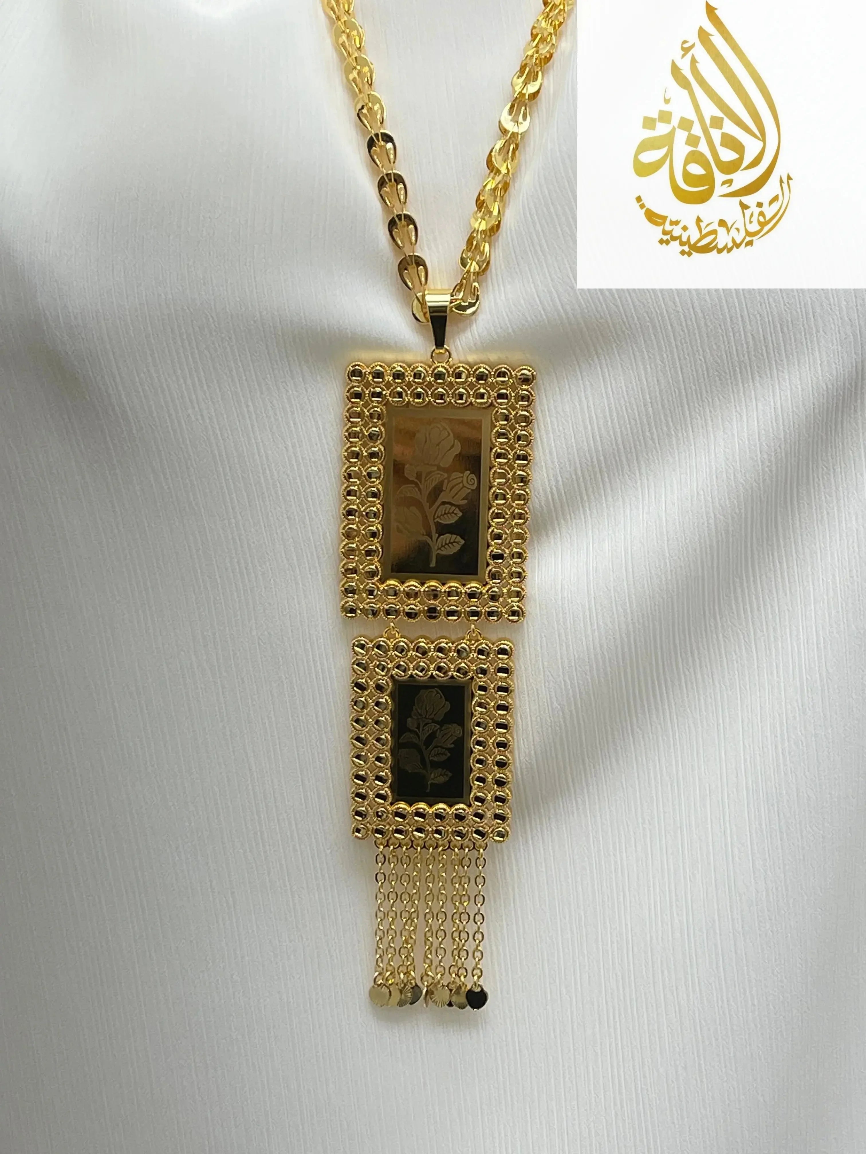 Palestinian embroidered gold necklace with two rectangular pendants and chain tassels
