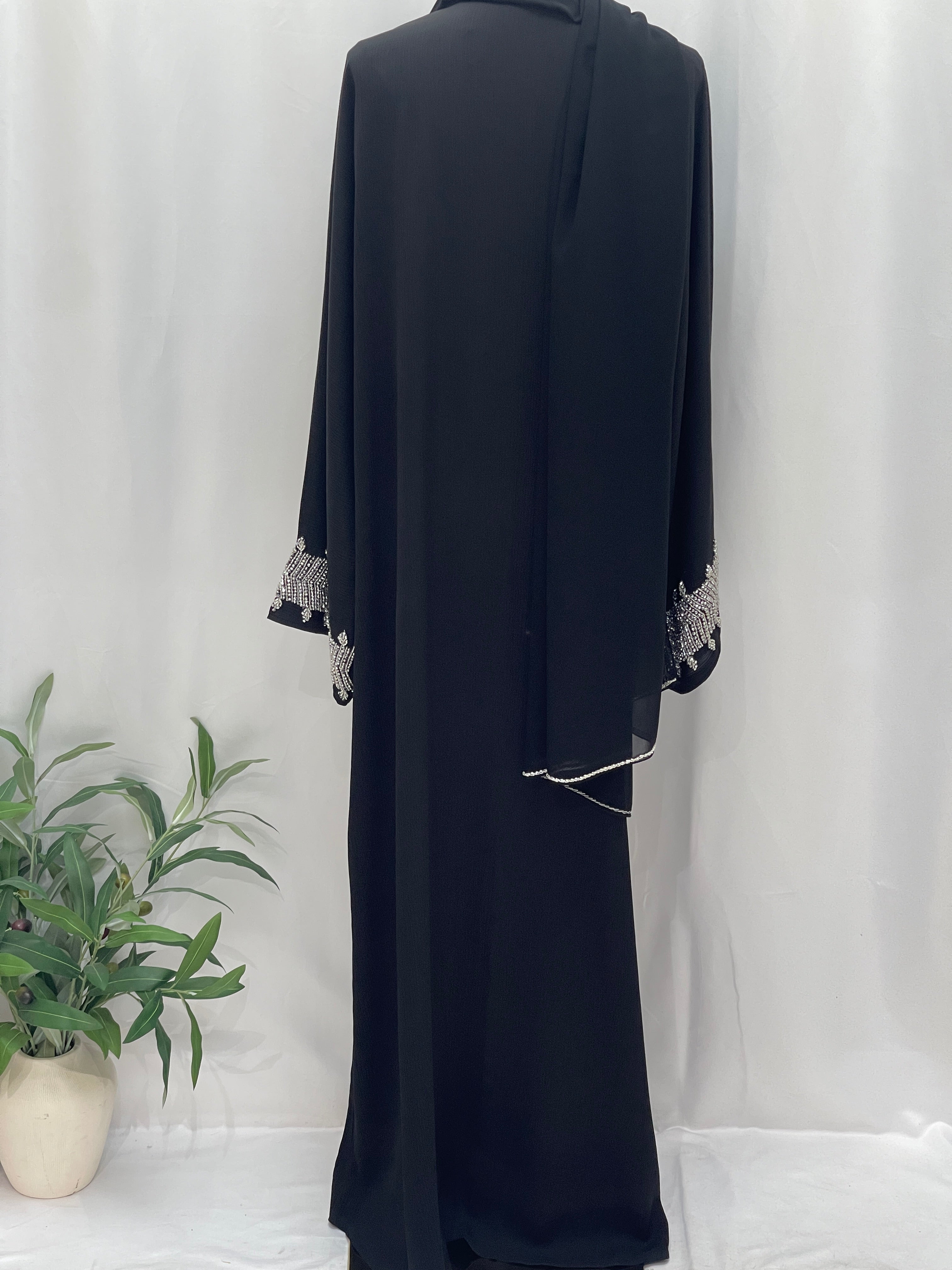 Black Palestinian Luxury Modest Fashion Abaya with silver embroidery on sleeves by Palestinian Elegance