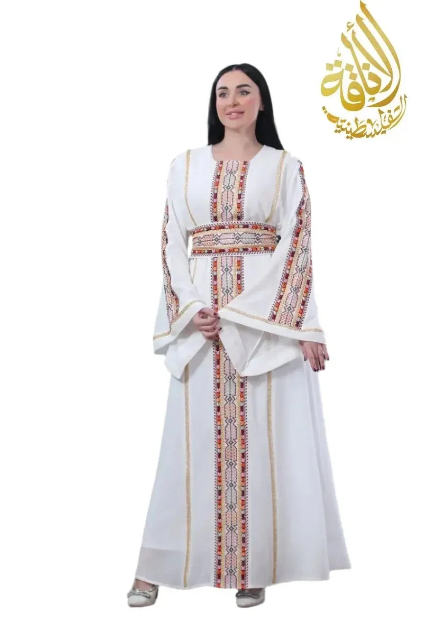 Embroidered Palestinian kaftan by Palestinian Elegance in white with traditional colorful embroidery