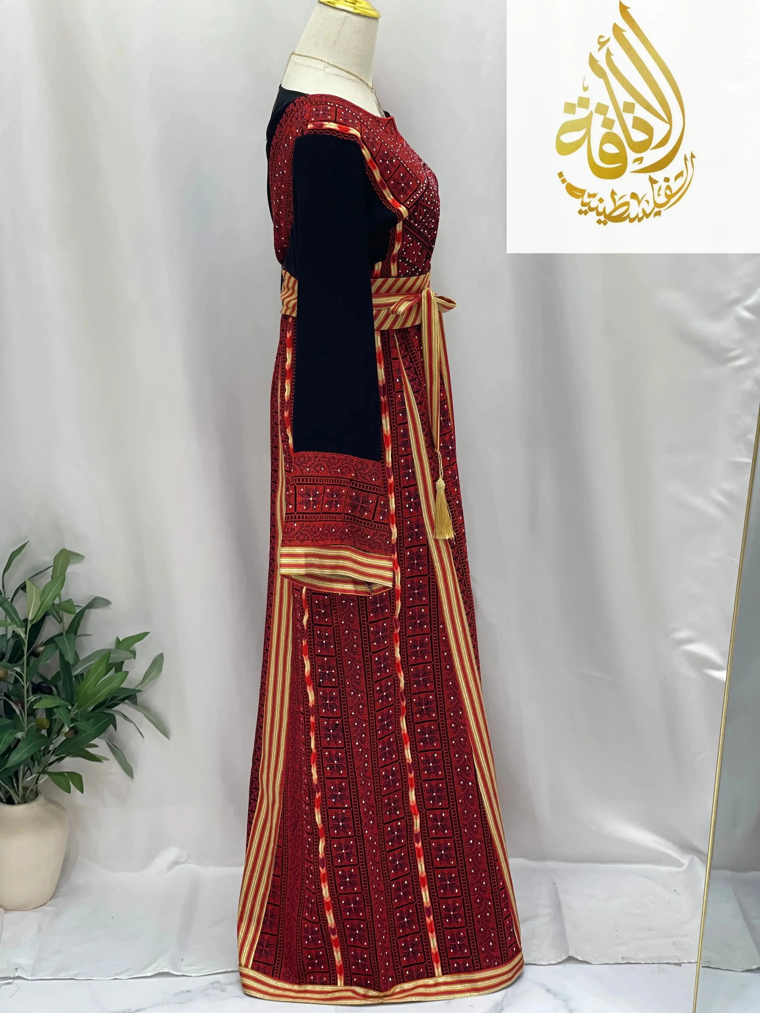Embroidered Palestinian thoub dress with intricate red and black traditional embroidery from Palestinian Elegance