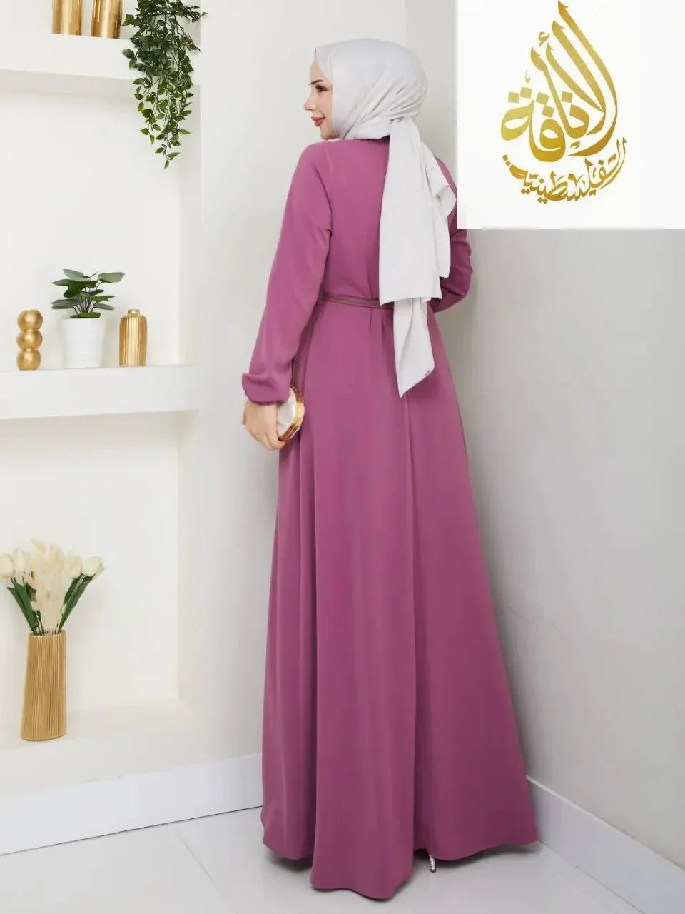 Palestinian Elegance elegant long dress for special occasions in mauve with long sleeves and belted waist