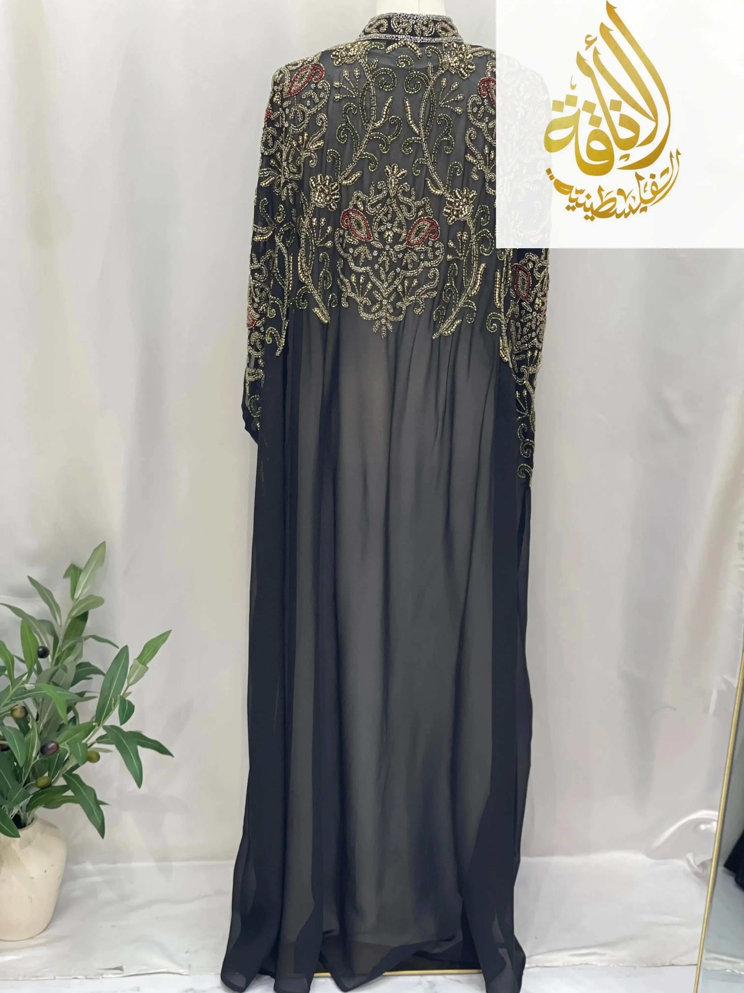 Palestinian Elegance black cardigan with intricate embroidery and sheer fabric elegant modest fashion cape