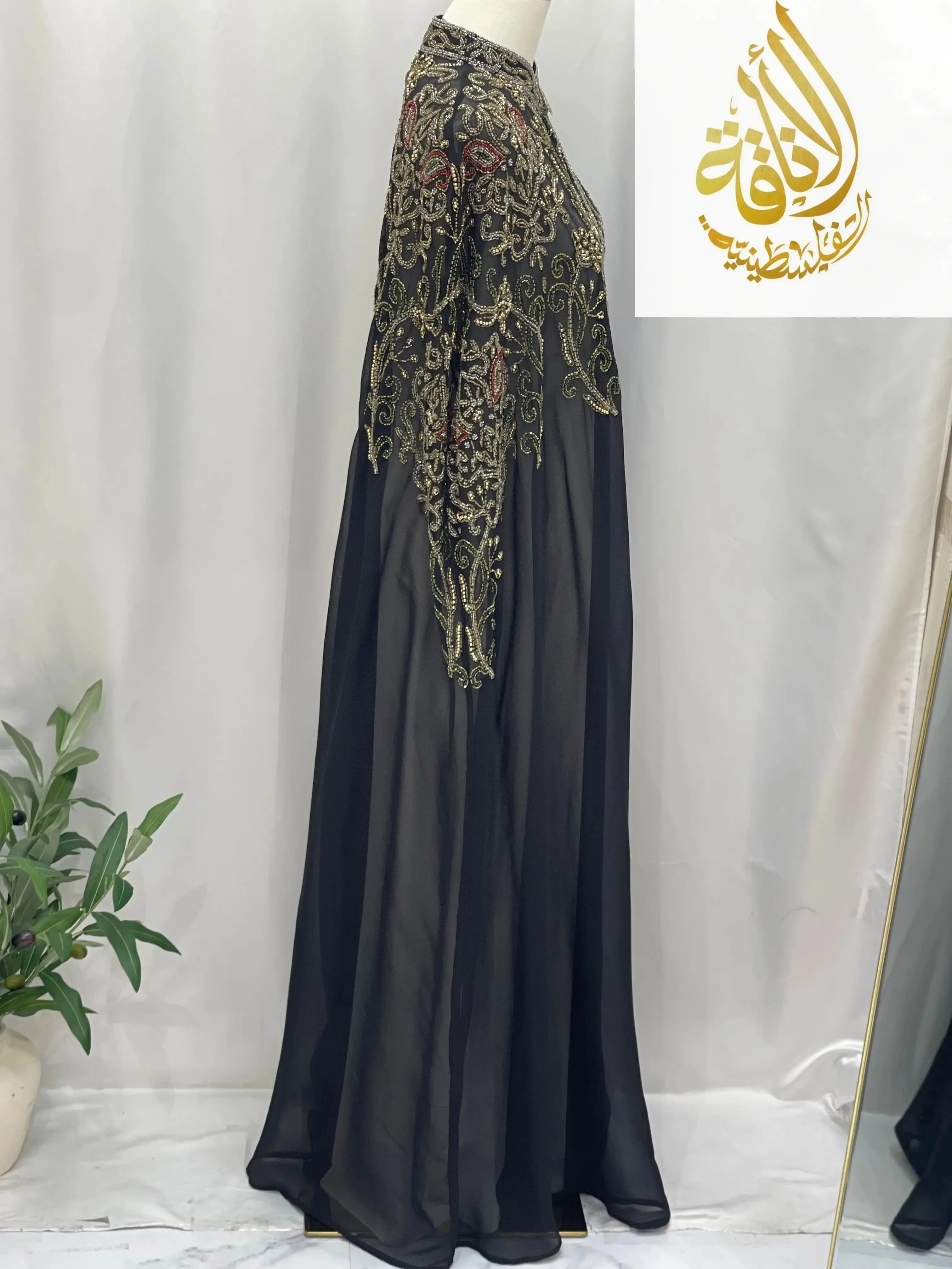 Palestinian Elegance black cardigan with intricate gold embroidery elegant modest fashion cape style