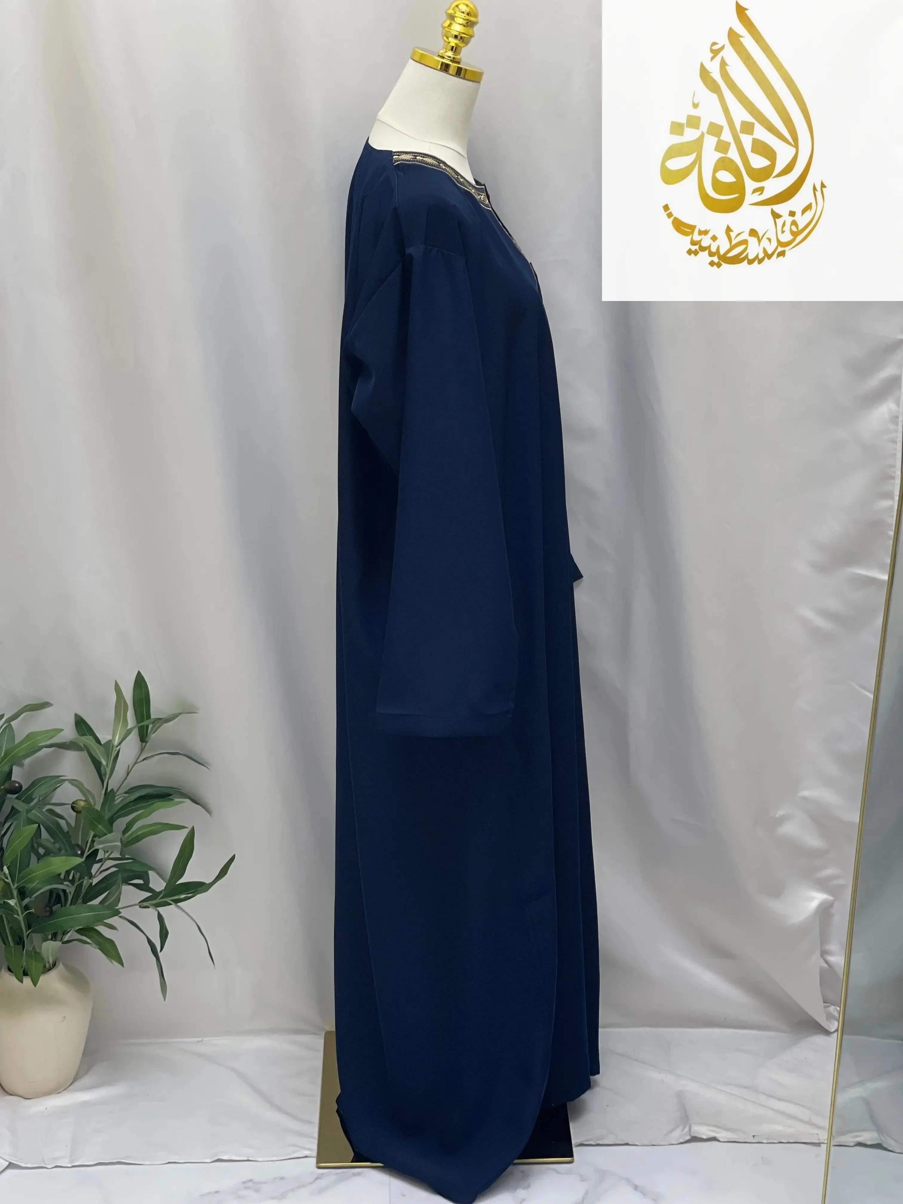 Palestinian Elegance navy men thobe featuring detailed embroidery on neckline embroidered thobe dress