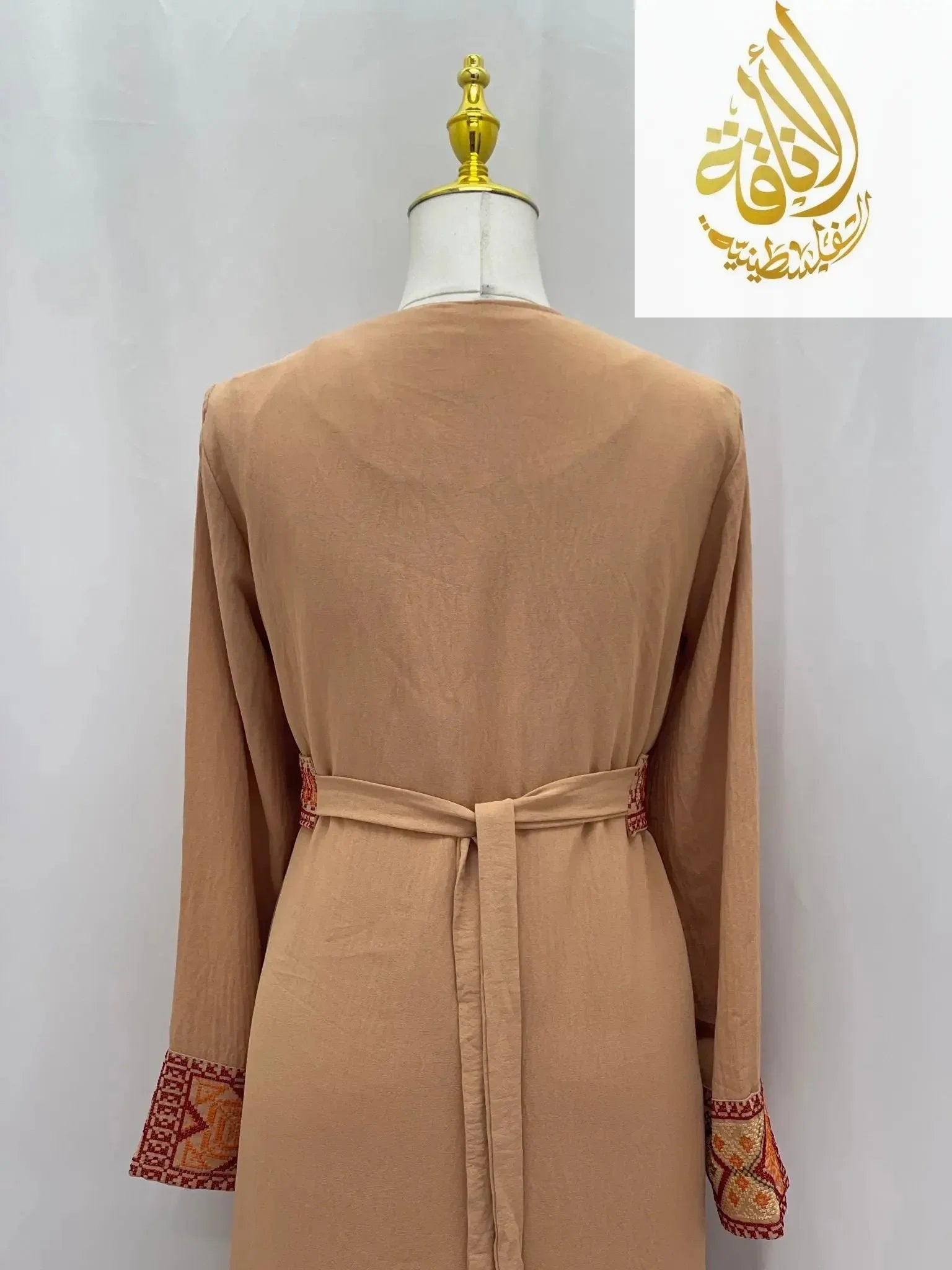 Back view of Palestinian Elegance Embroidered 2Pcs Abaya in light brown with detailed embroidery on cuffs and waist tie