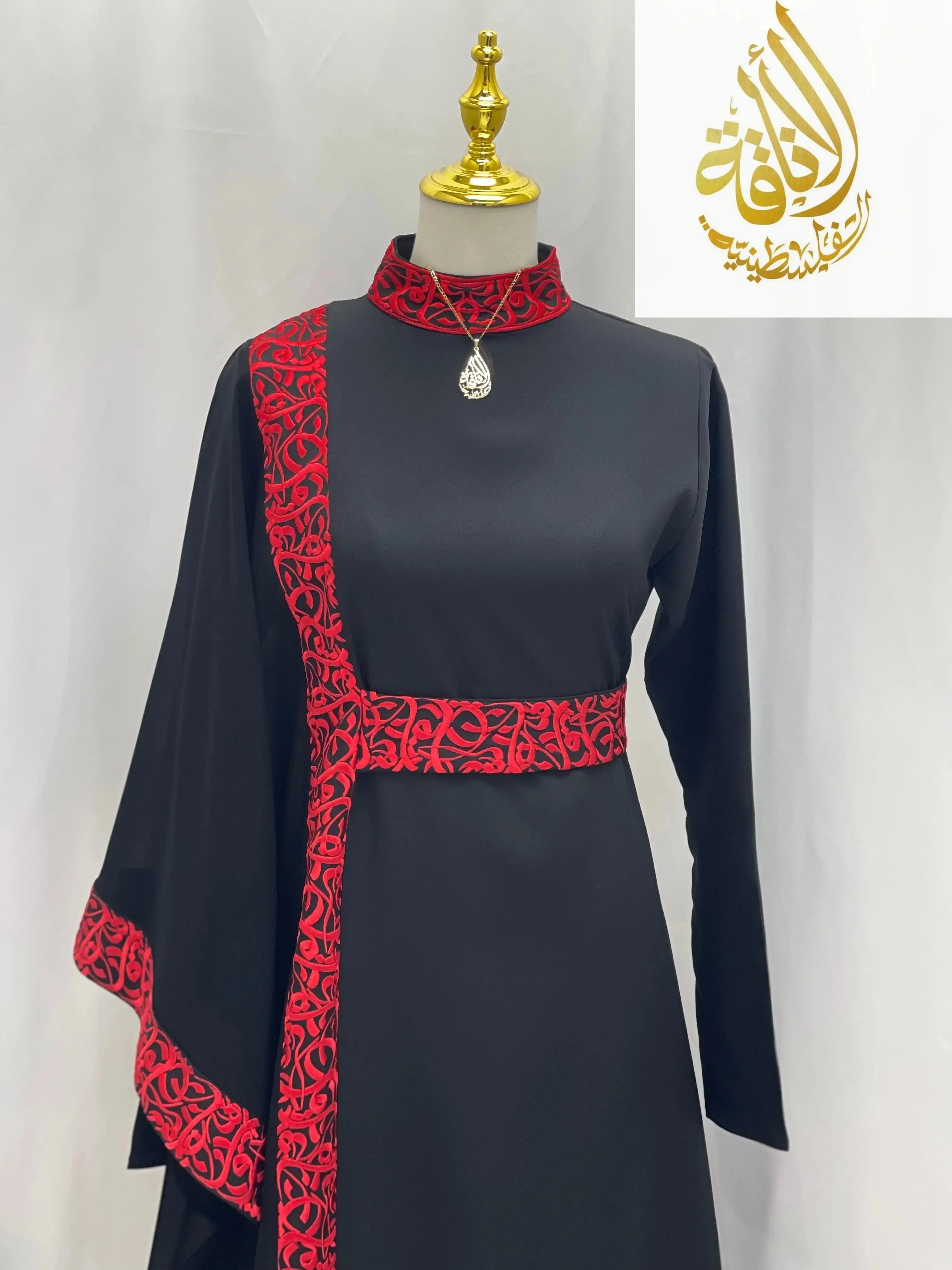 Palestinian Elegance embroidered abaya with Arabic letters in black with red detailed embroidery on collar, belt, and sleeve