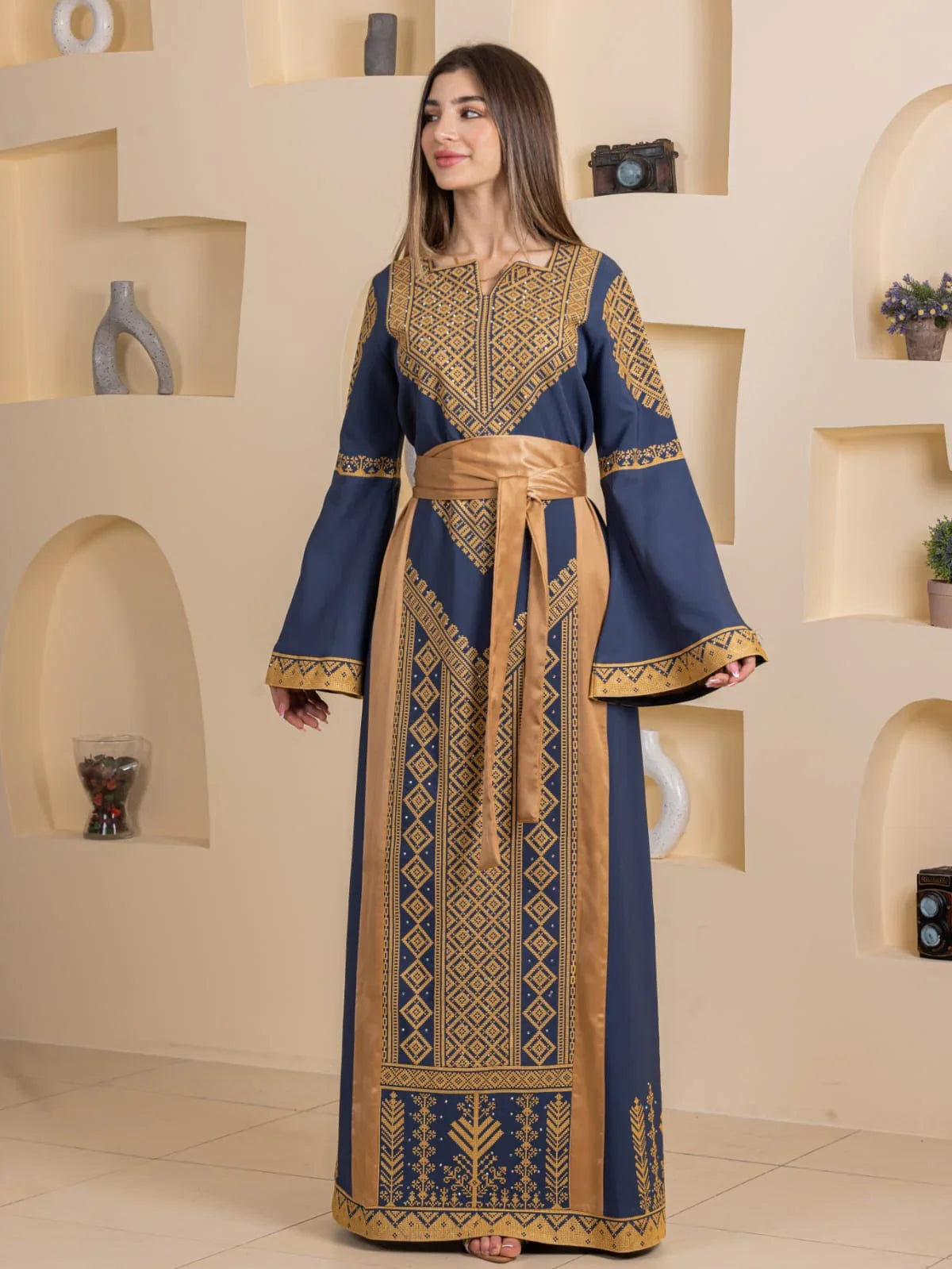 Palestinian Elegance Embroidered Elegance Dress in navy blue with gold geometric embroidery and sash belt
