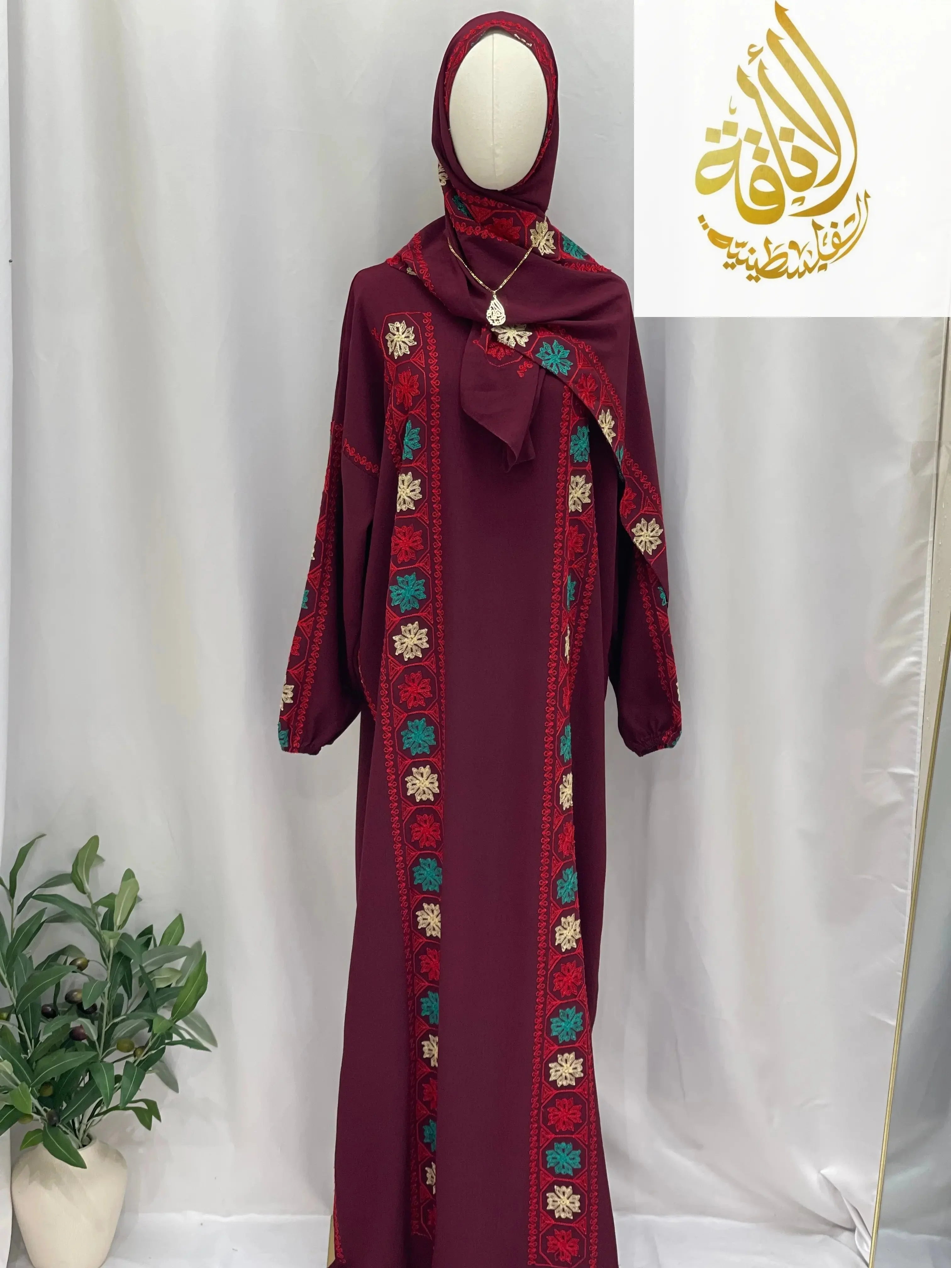 Palestinian Elegance embroidered prayer dress in deep red with colorful floral embroidery and matching hijab