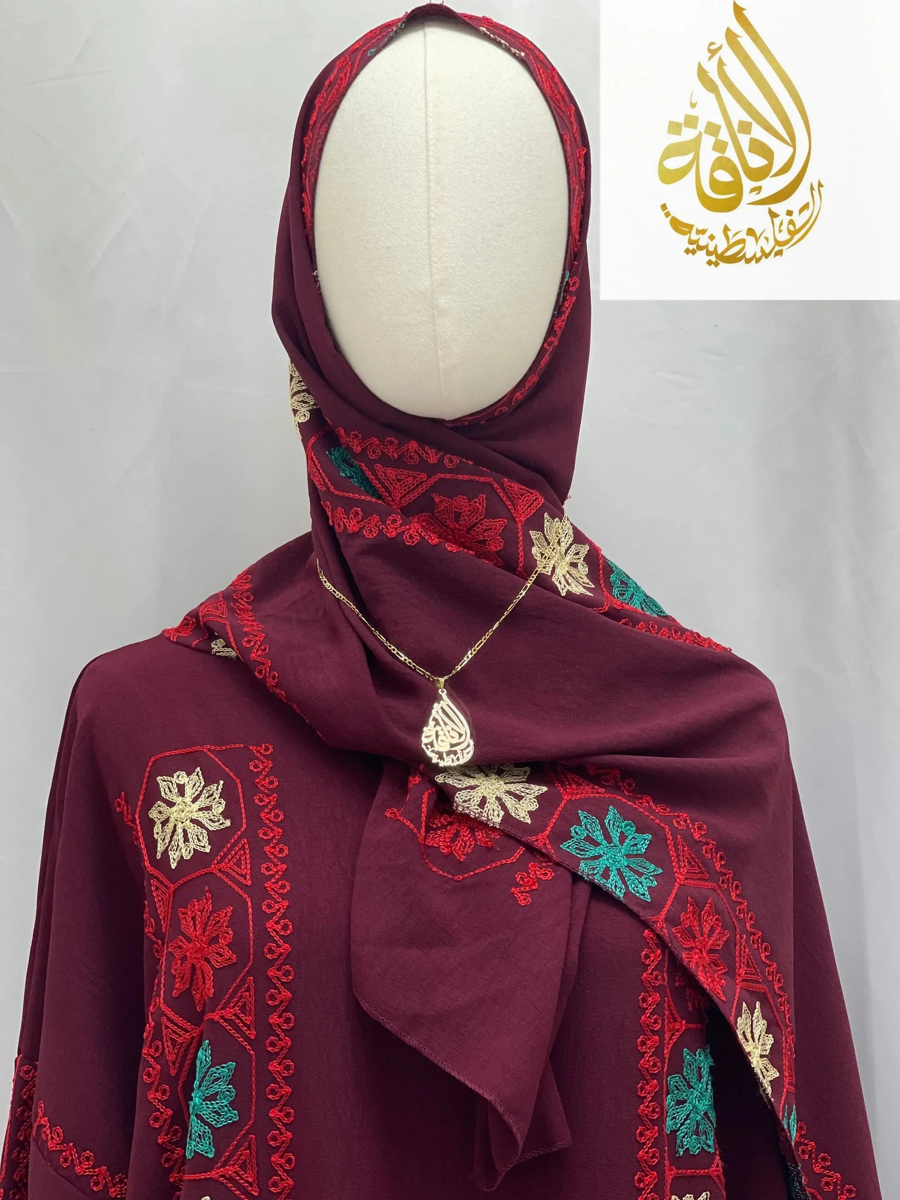 Palestinian Elegance embroidered prayer dress in burgundy with red, green, and cream floral embroidery