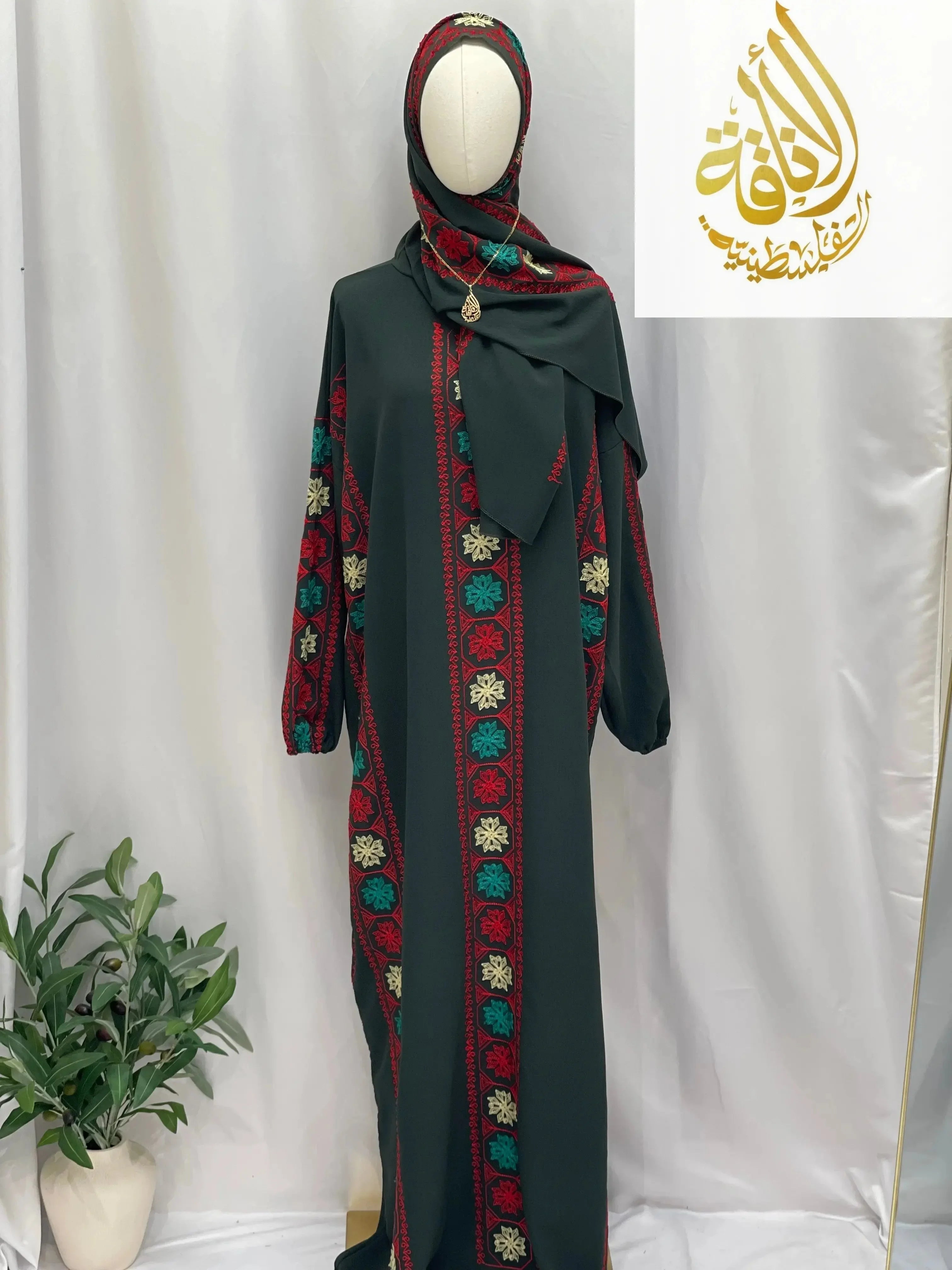 Palestinian Elegance embroidered prayer dress with multicolor detailed patterns on black fabric full-length design