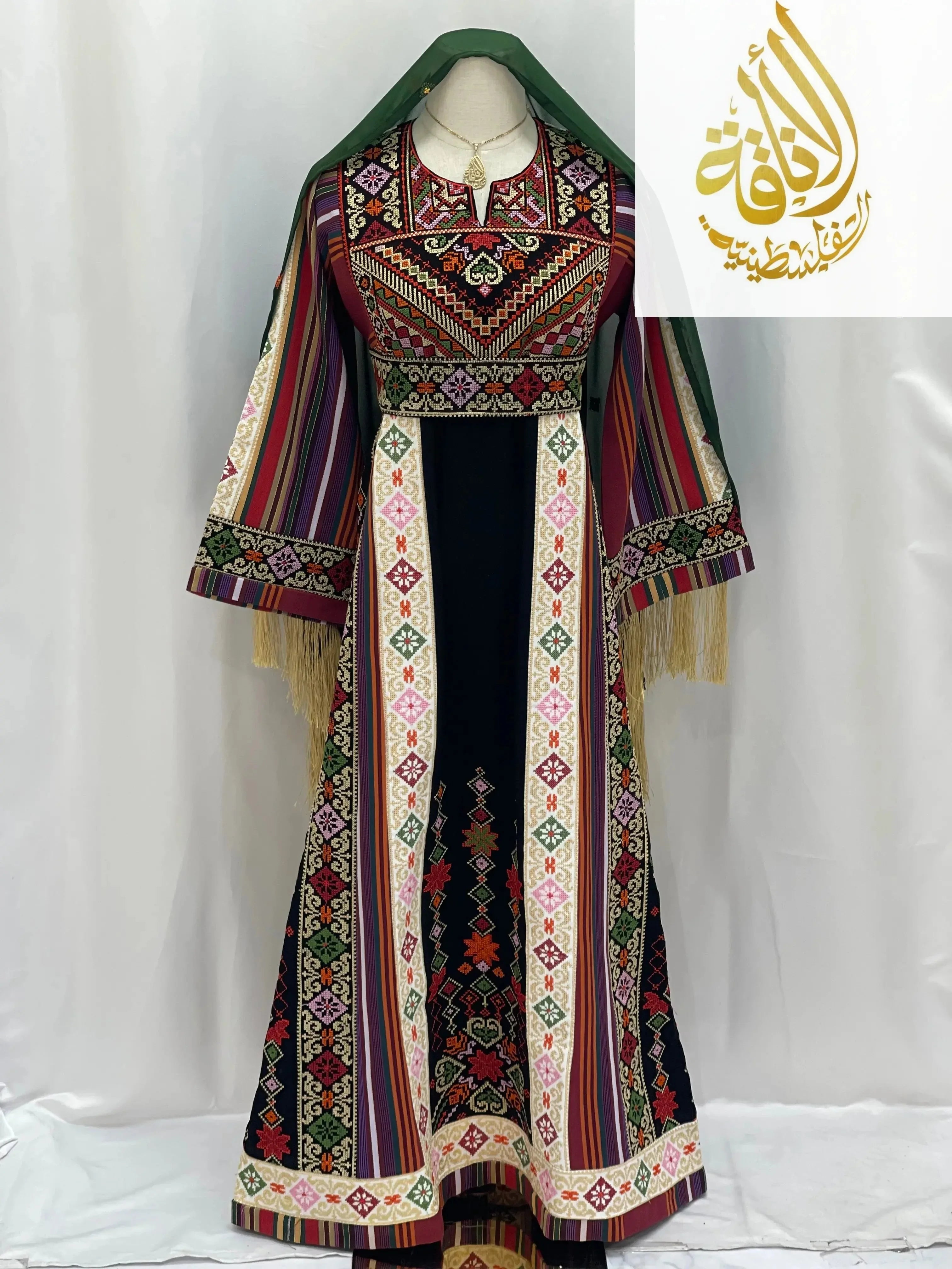 Traditional embroidered thoub for teens by Palestinian Elegance with colorful intricate patterns and green headscarf