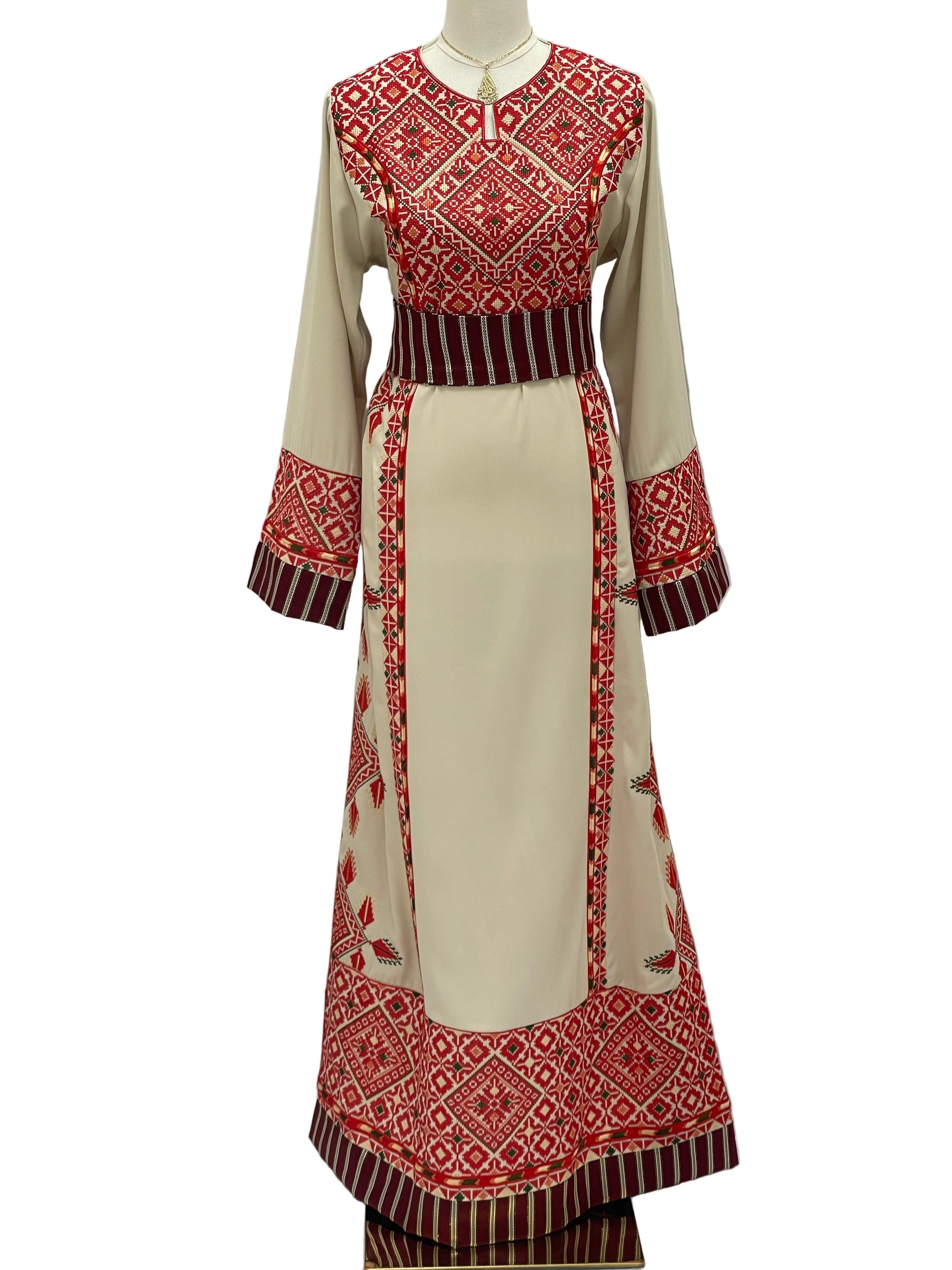 Embroidered Thobe Al-Yamama featuring intricate red and beige patterns, perfect for elegant occasions