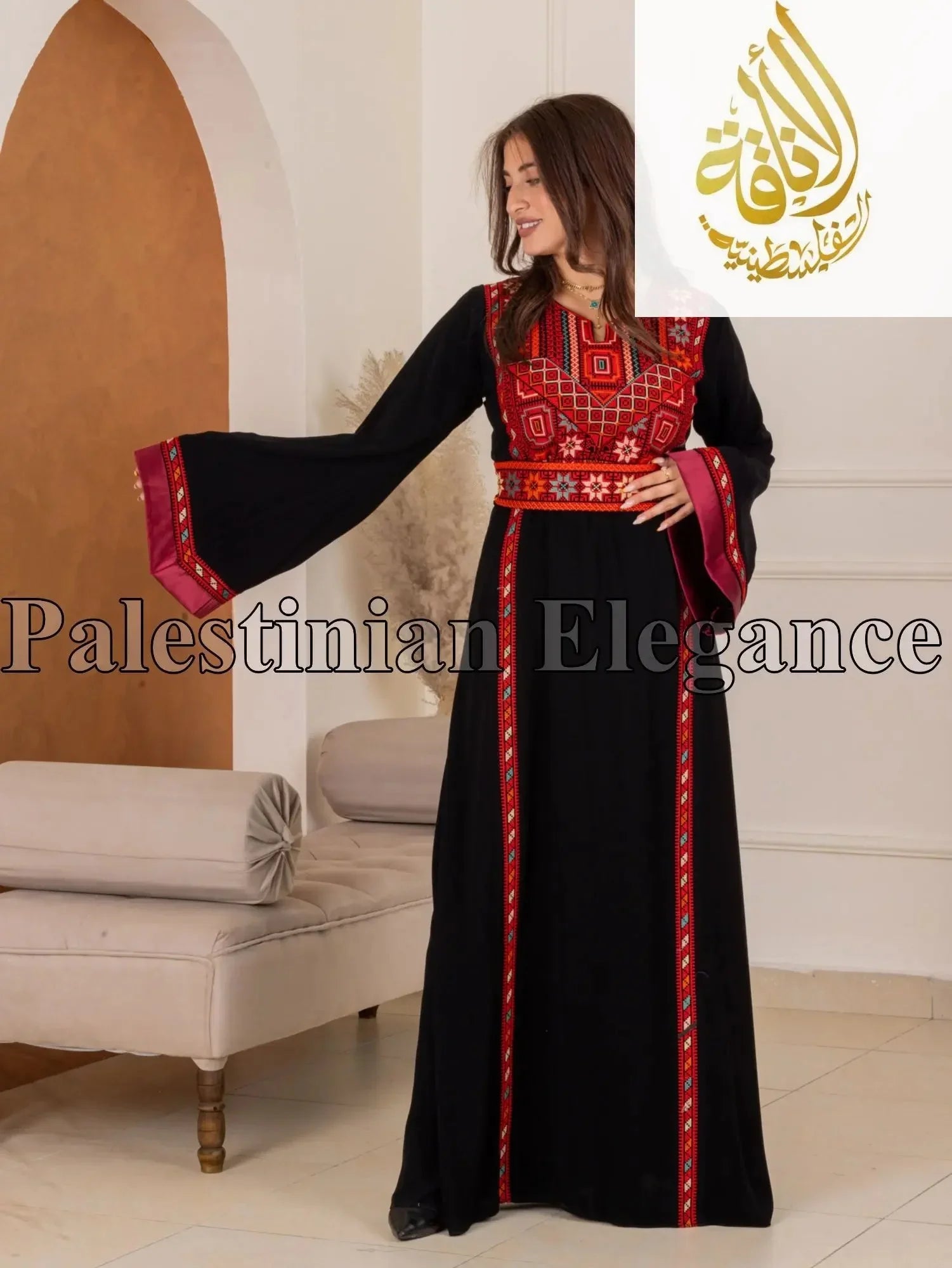 Woman wearing black Fadwa Embroidered Thoub with red and white traditional Palestinian embroidery by Palestinian Elegance
