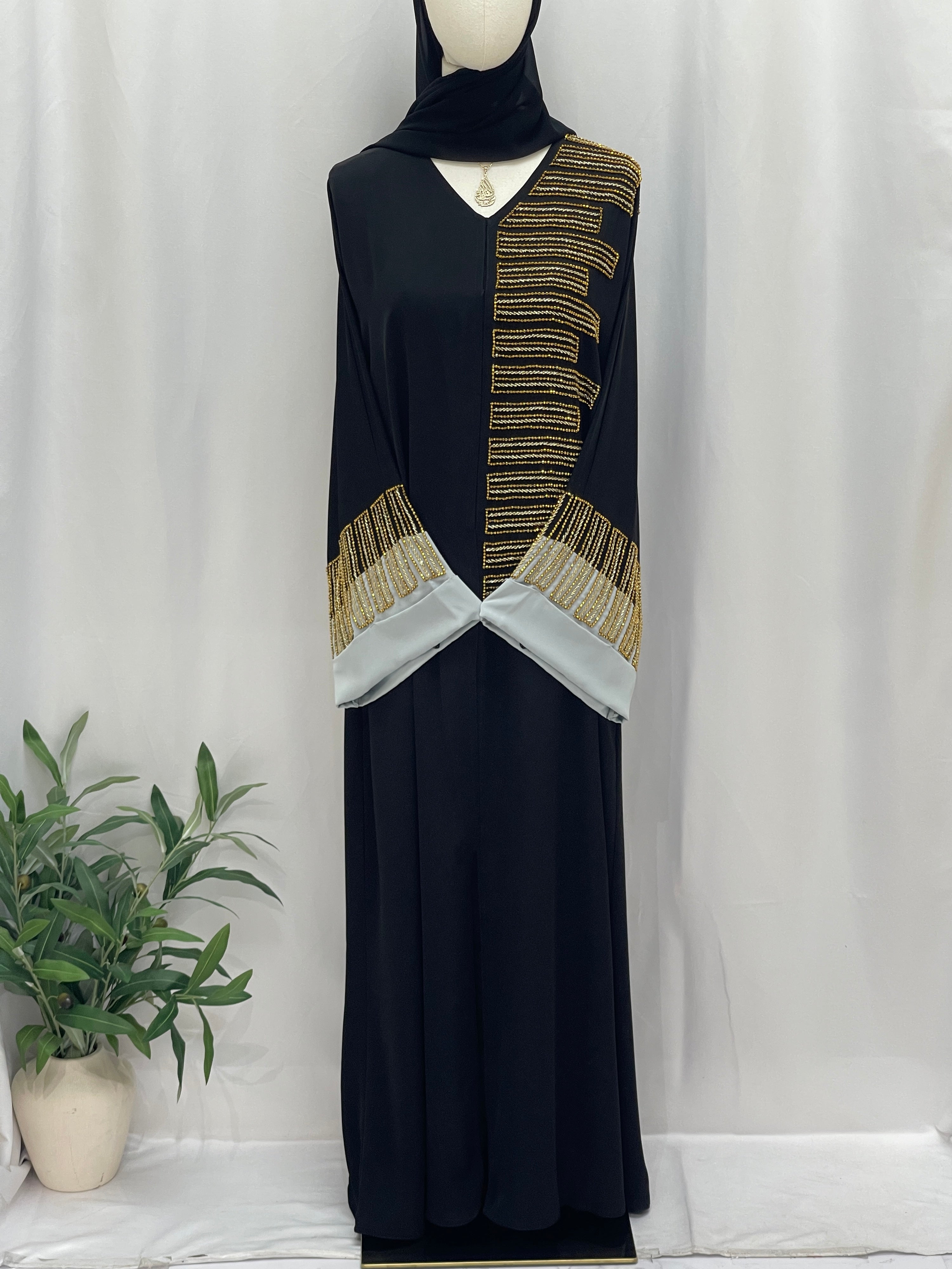 Palestinian Elegance Fancy Beads Dubai Abaya black abaya with gold bead geometric trim and white cuffs