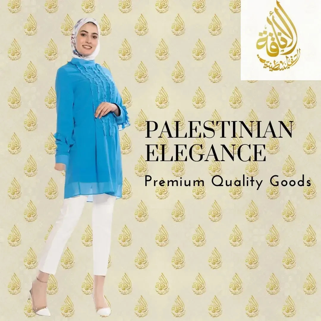 Luxury women's embroidered shirt in blue casual style by Palestinian Elegance worn with white pants