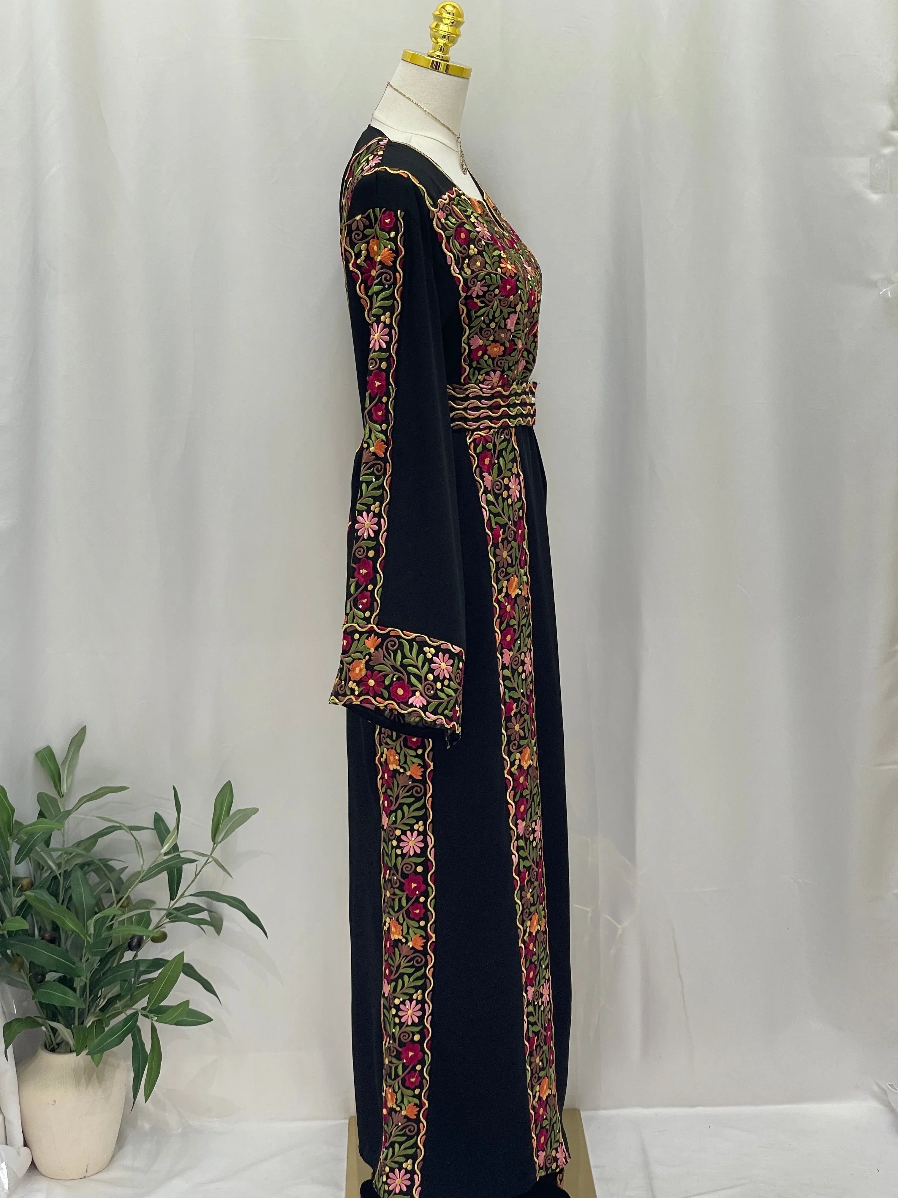 Floral Essence Embroidered Thobe in black with vibrant floral embroidery detailing and elegant design