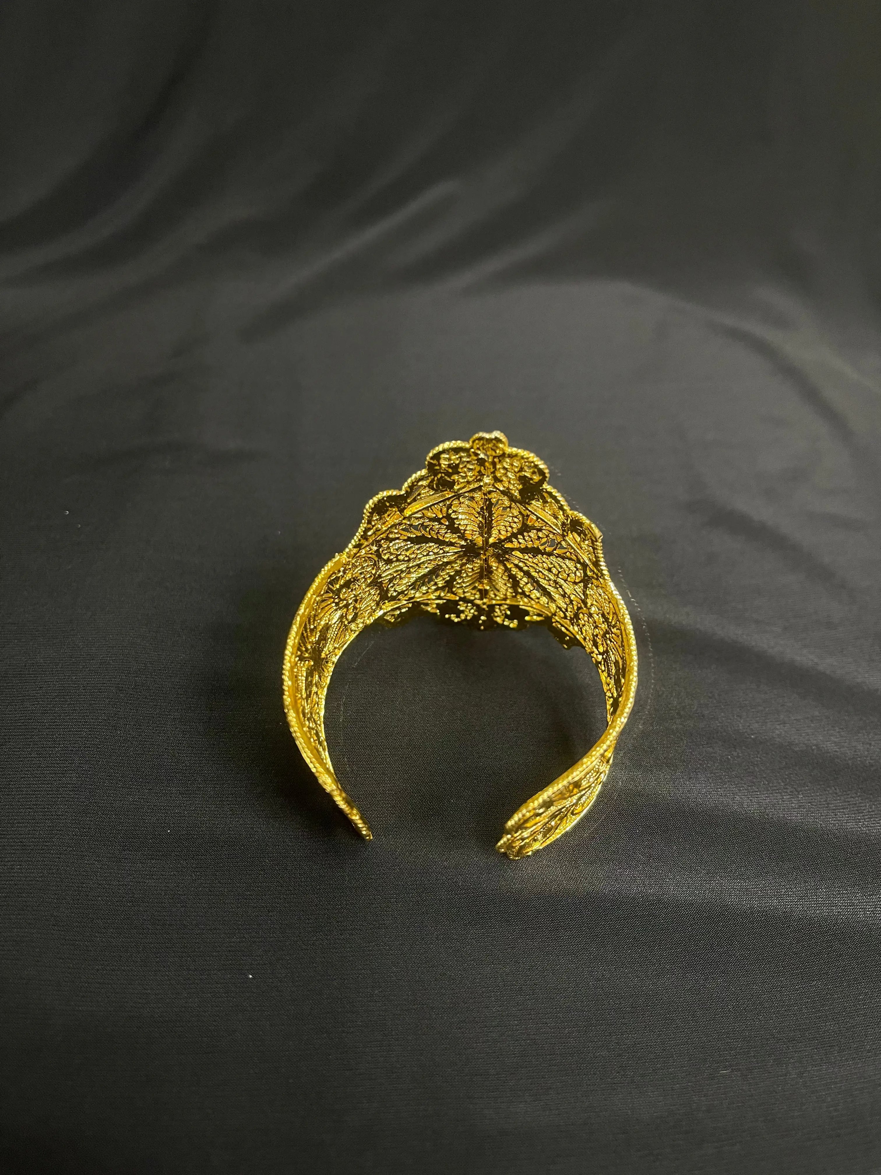 Palestinian Elegance Flower Cuff Bracelet with imitated Gold featuring intricate floral design on black background