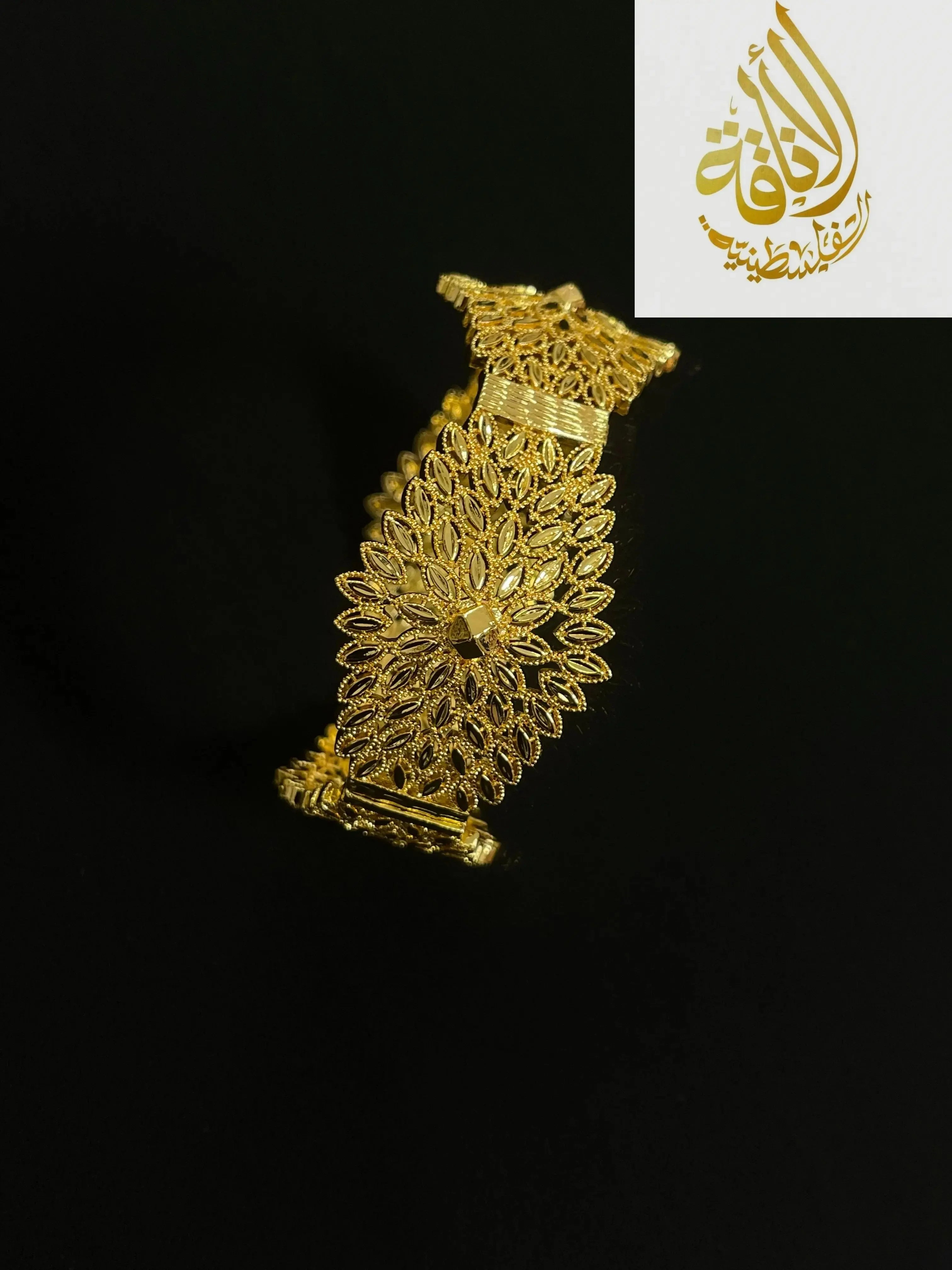 Intricate Palestinian gold jewelry set bracelet with delicate floral filigree design on black background