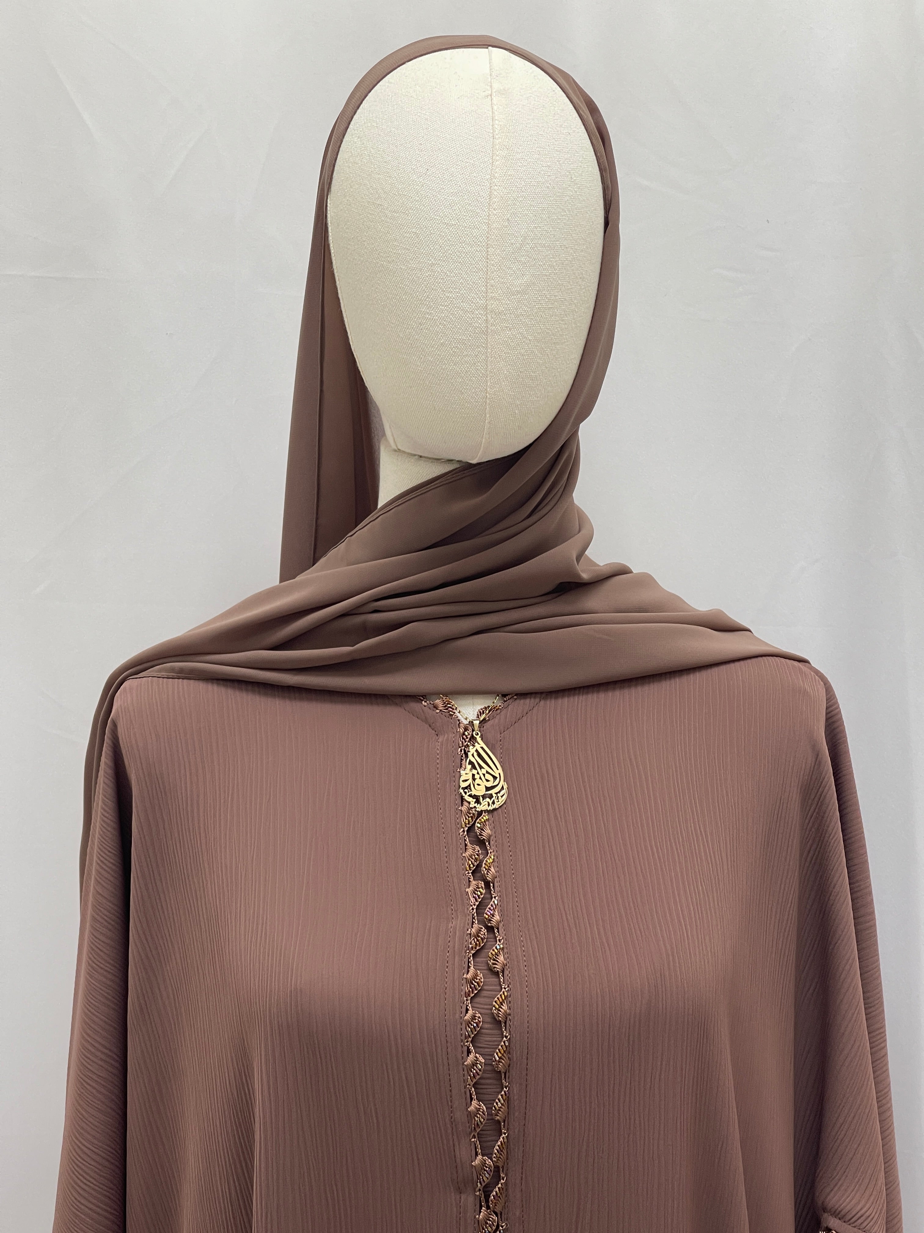 Palestinian Elegance Ghosoon Abaya in brown with delicate front embroidery and gold pendant detail