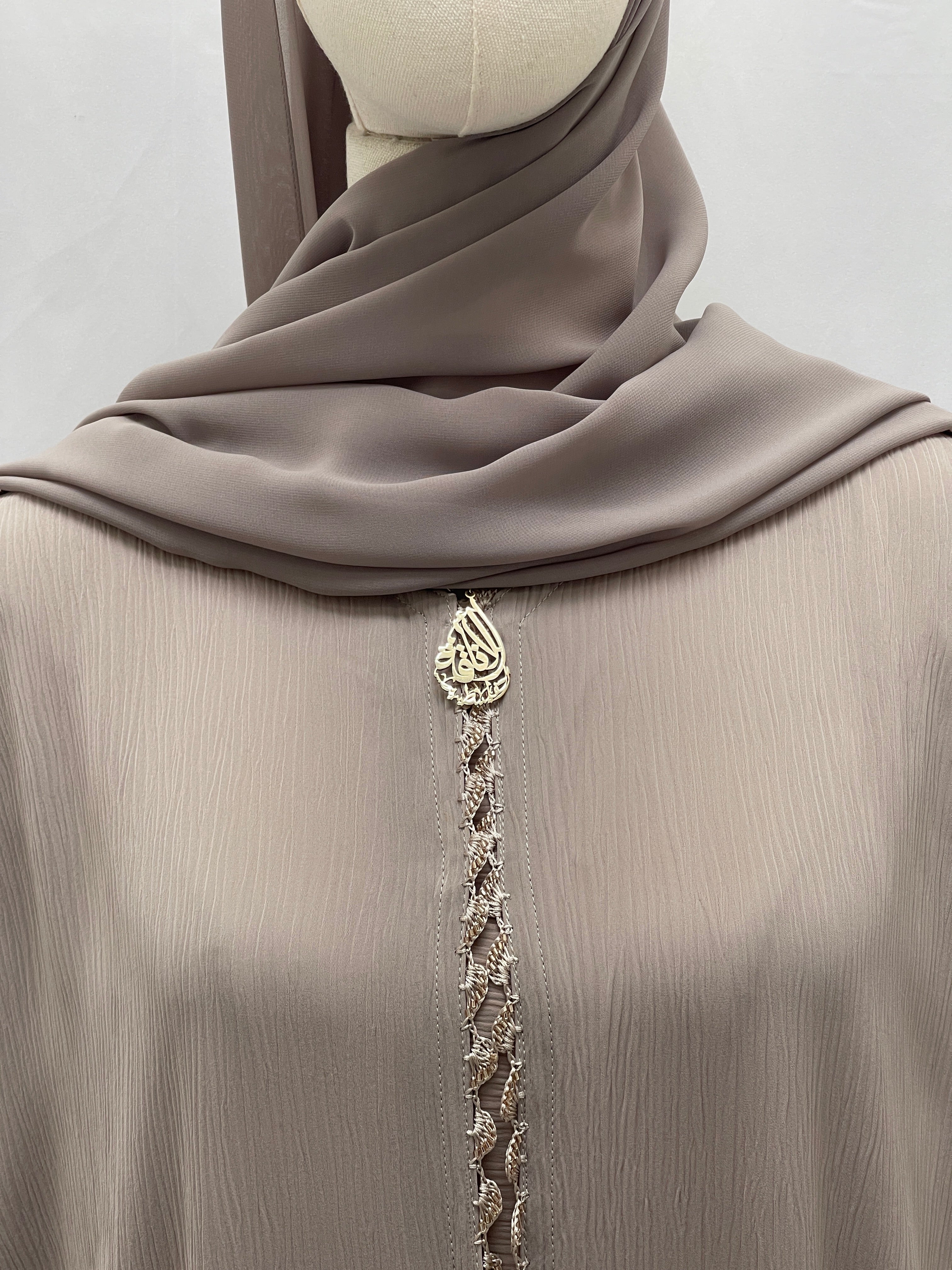 Palestinian Elegance Ghosoon Abaya in soft taupe fabric with intricate front embellishment and matching hijab