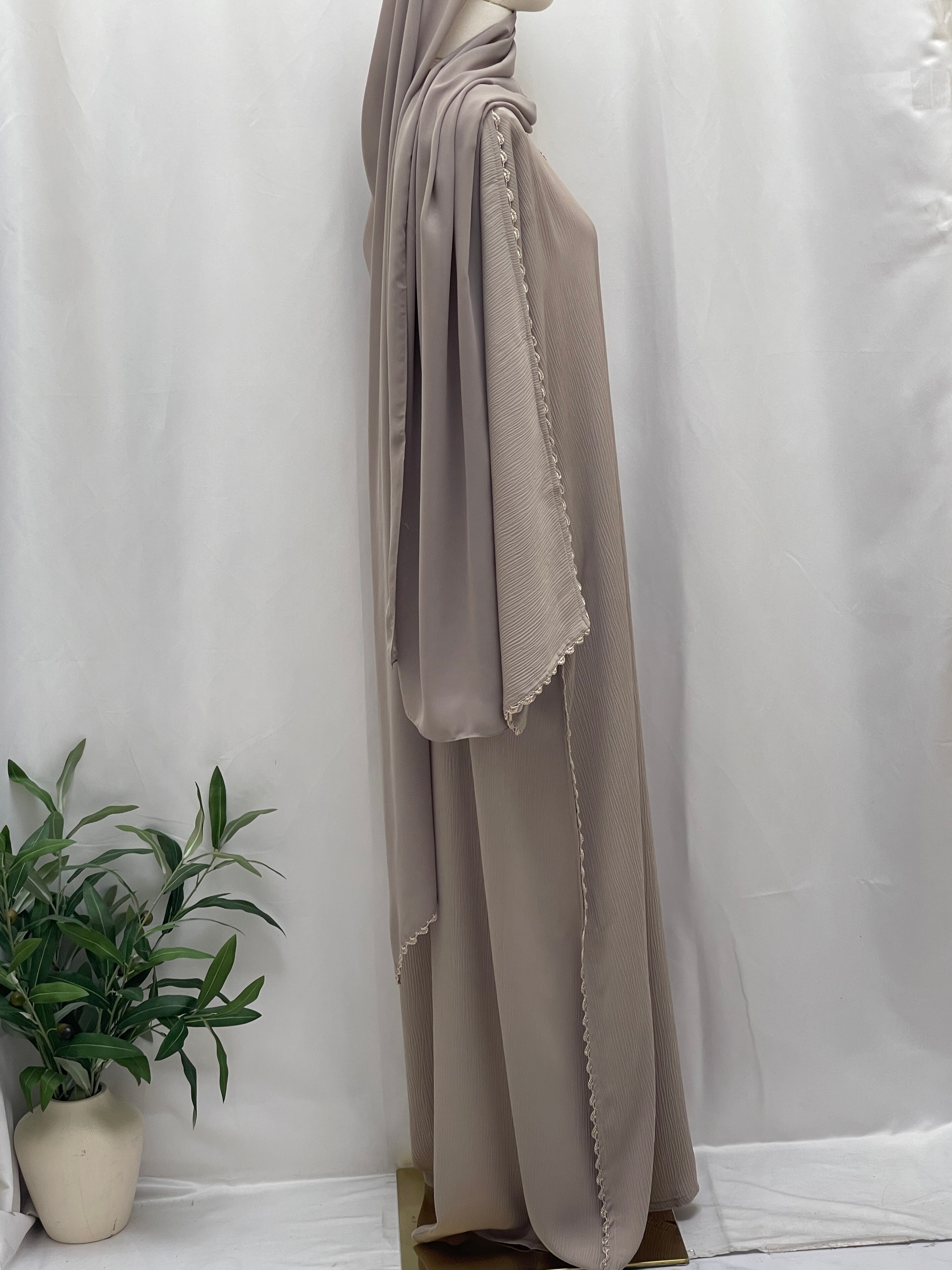Palestinian Elegance Ghosoon Abaya in soft taupe with detailed edging on sleeves and flowing fabric