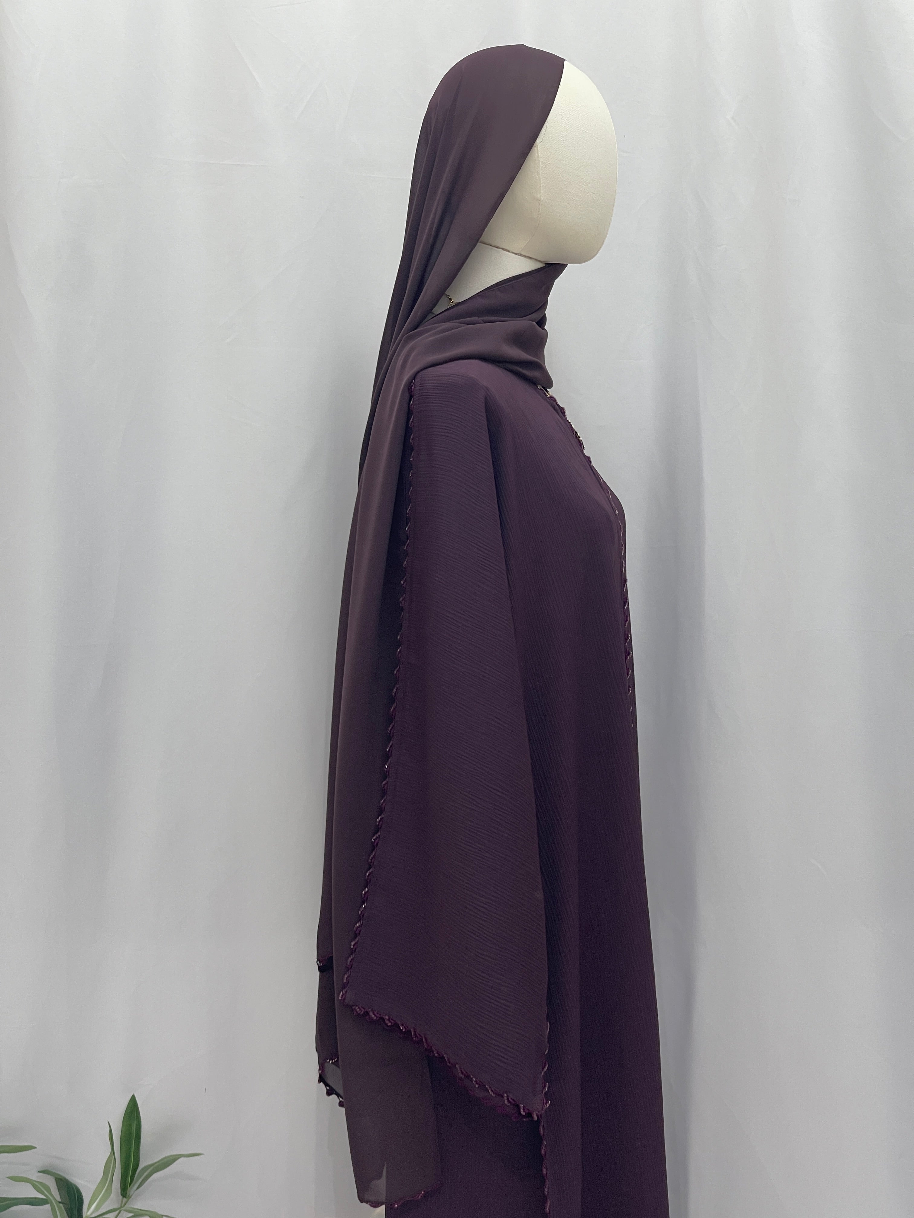 Palestinian Elegance Ghosoon abaya purple side profile embroidery long sleeve