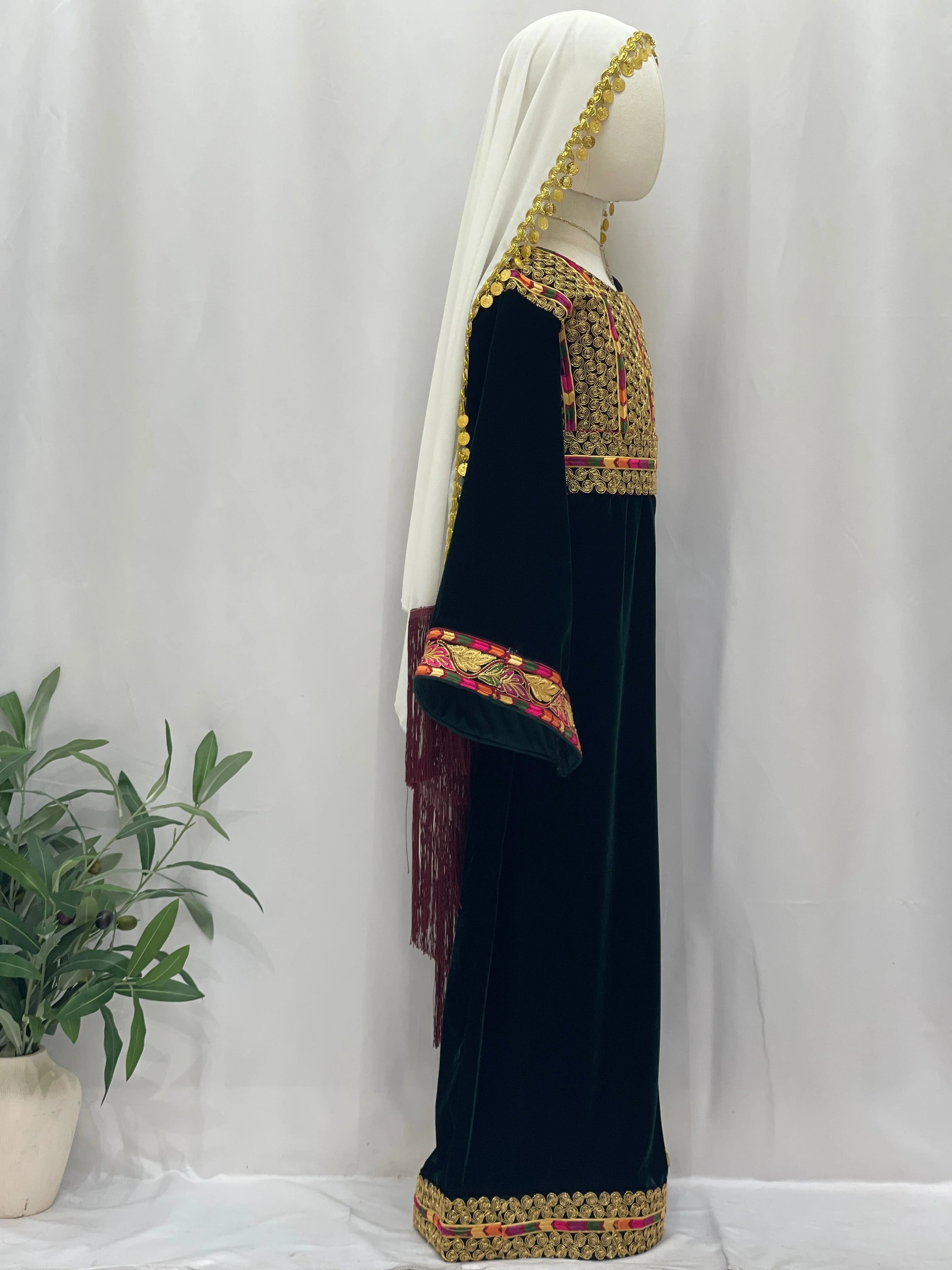 Emerald Velvet Embroidered Qasab Thobe with intricate designs, featuring a side view and elegant embroidery