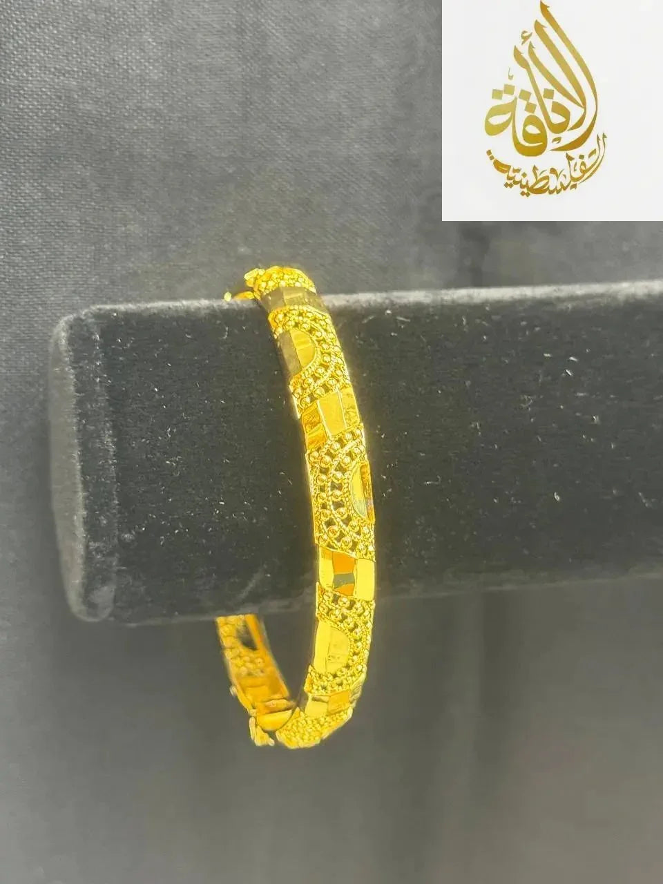 Imitated gold bangle bracelet for women with intricate engraved patterns by Palestinian Elegance