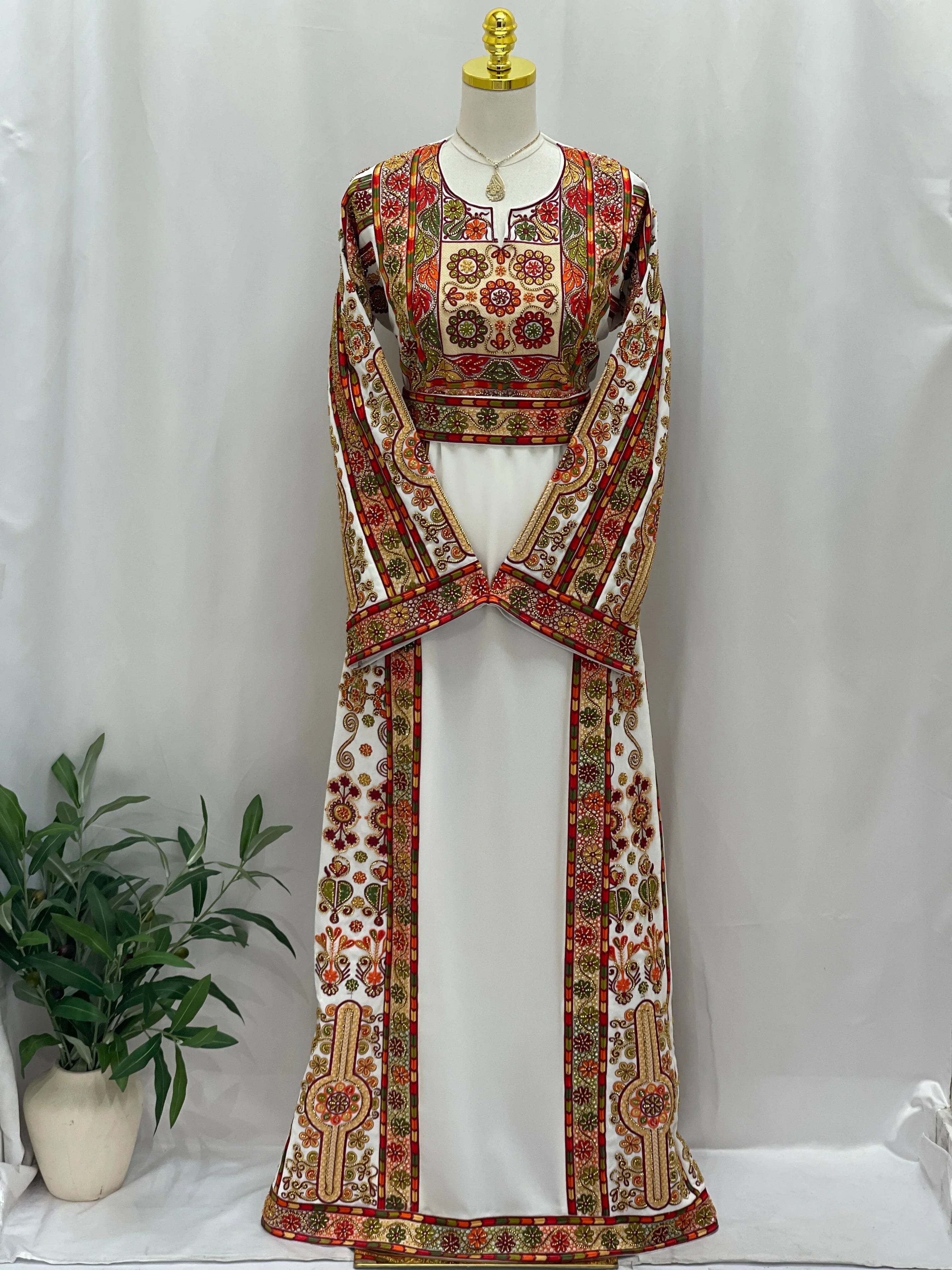 Golden Blossom Beaded Embroidered Thobe by Palestinian Elegance white thobe with red and gold floral beadwork